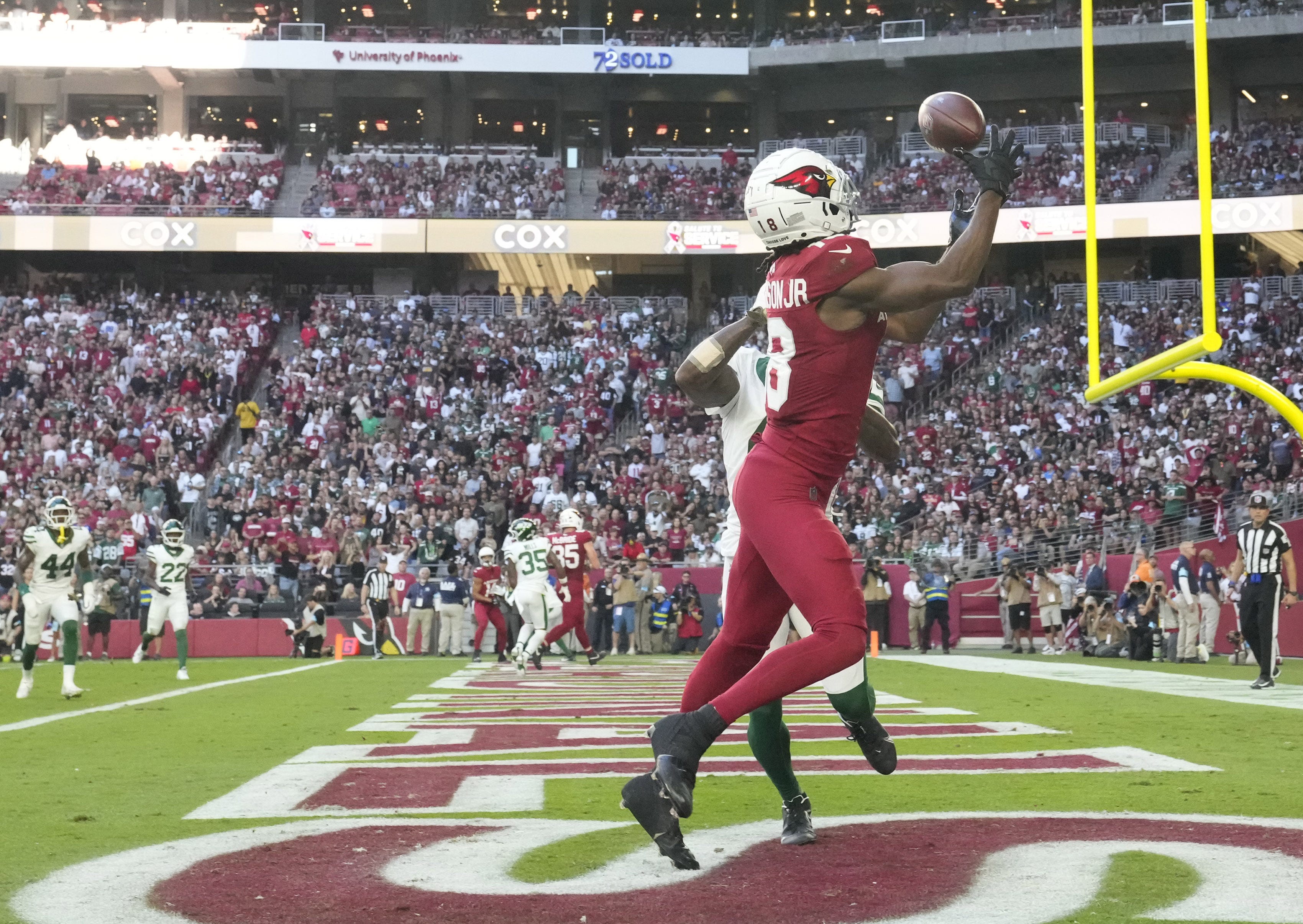 Arizona Cardinals wide receiver Marvin Harrison Jr. (18) catches a touchdown pass against New York Jets cornerback D.J. Reed (4)