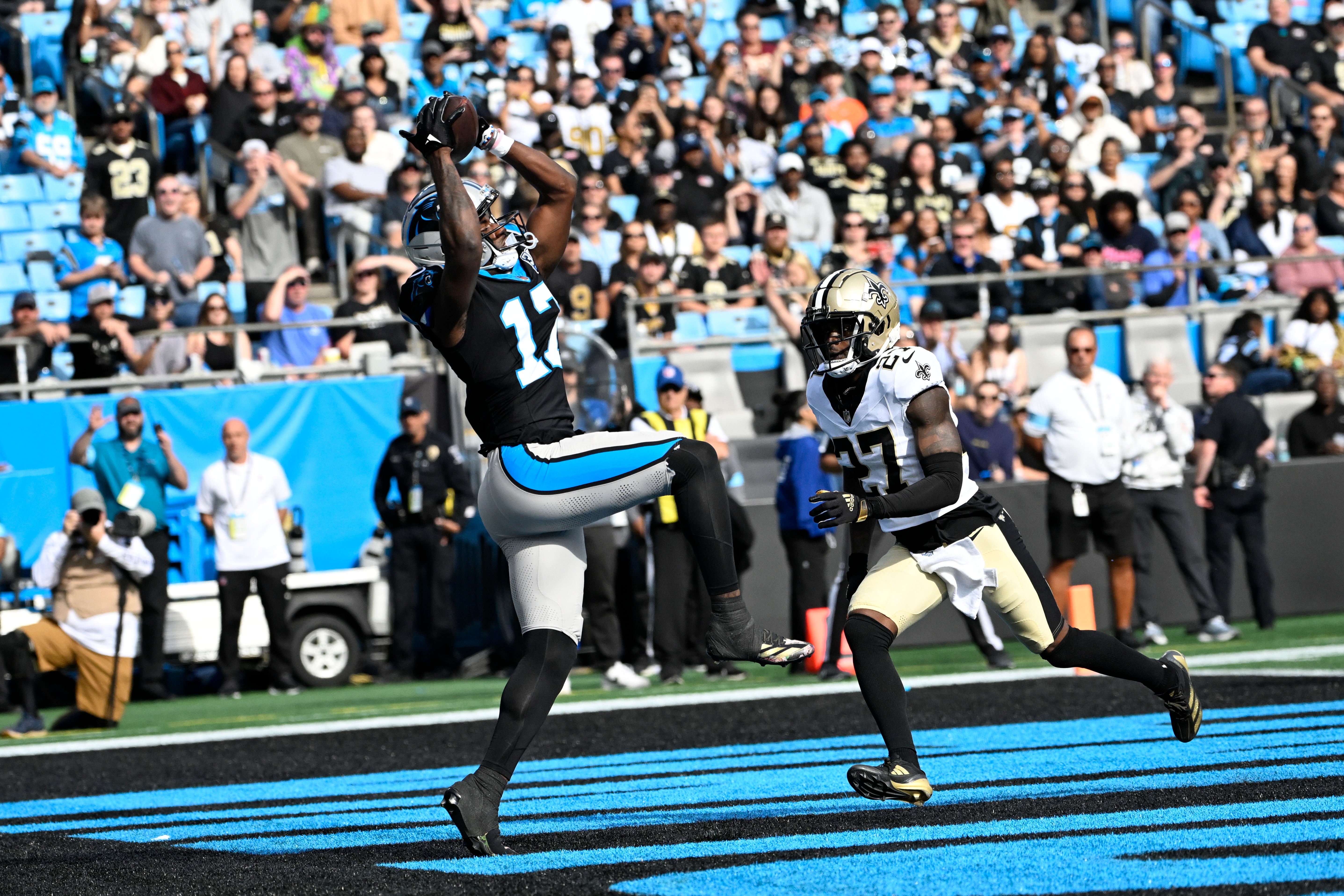 Carolina Panthers wide receiver Xavier Legette (17) catches a touchdown pass as New Orleans Saints cornerback Shemar Jean-Charles (27) defends