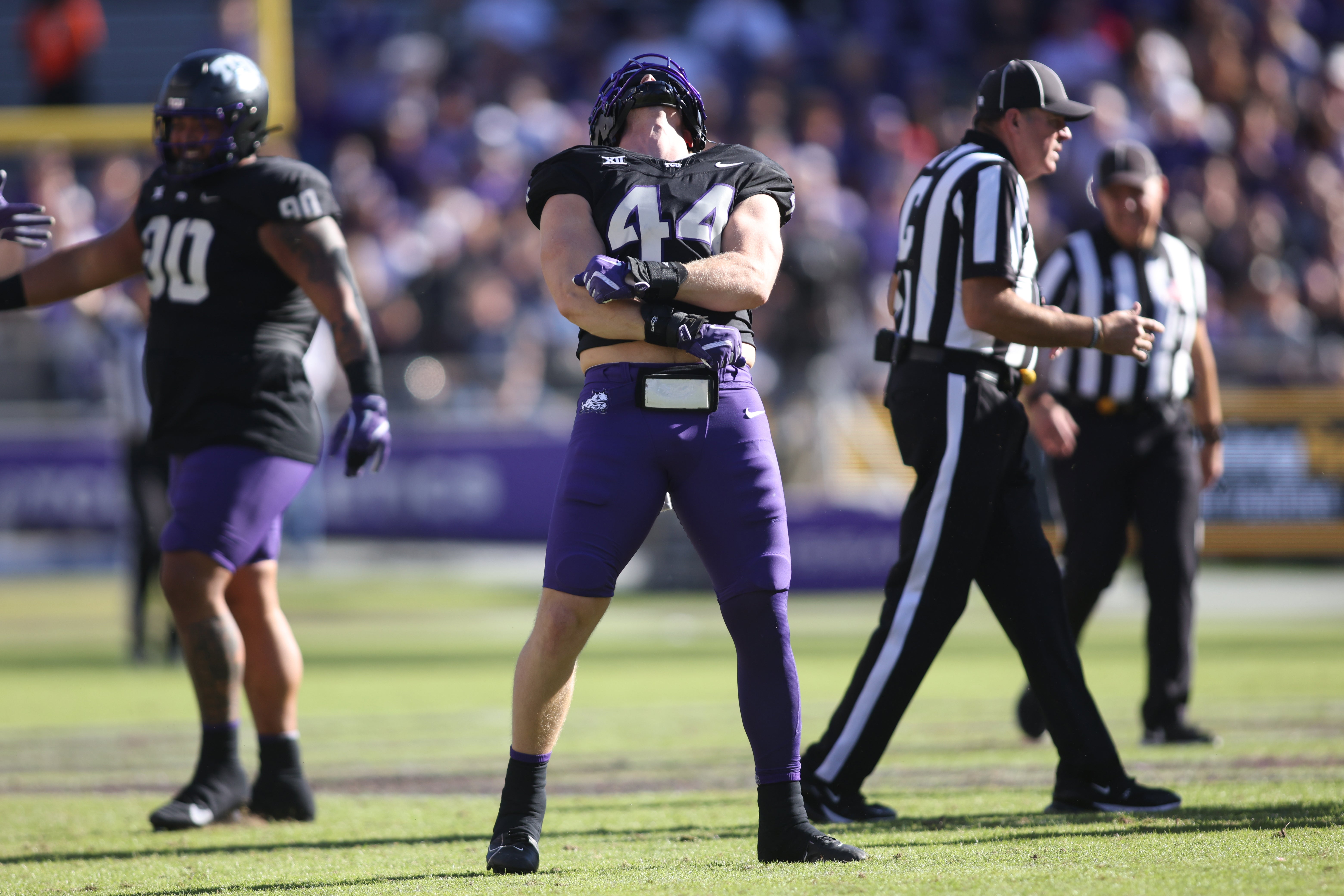 Nov 23, 2024; Fort Worth, Texas, USA; TCU Horned Frogs linebacker Cooper McDonald (44) reacts after making a sack against the Arizona Wildcats in the first quarter at Amon G. Carter Stadium.