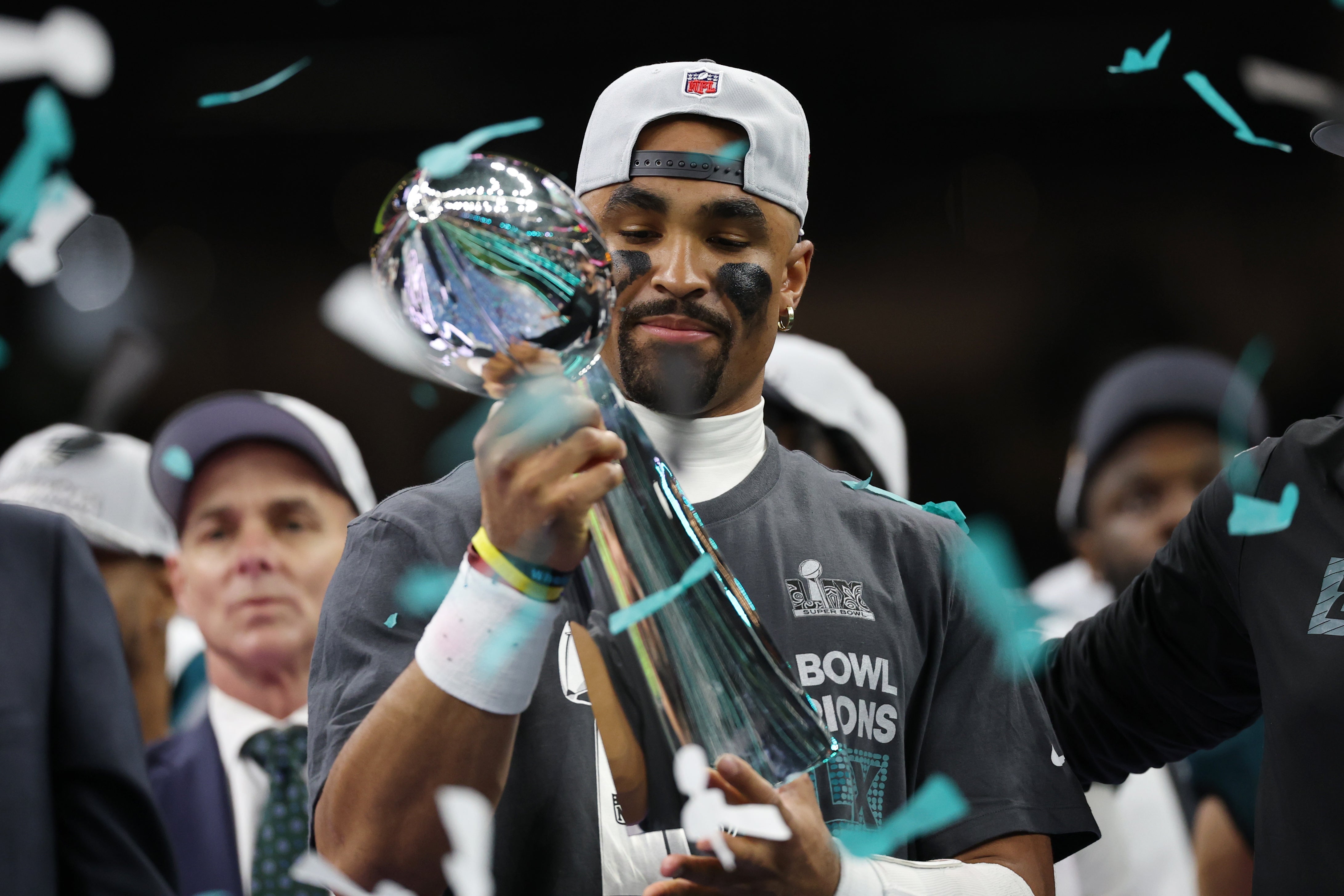 Philadelphia Eagles quarterback Jalen Hurts holds the Lombardi Trophy during the championship trophy presentation after the Eagles' game against the Kansas City Chiefs in Super Bowl LIX at Caesars.