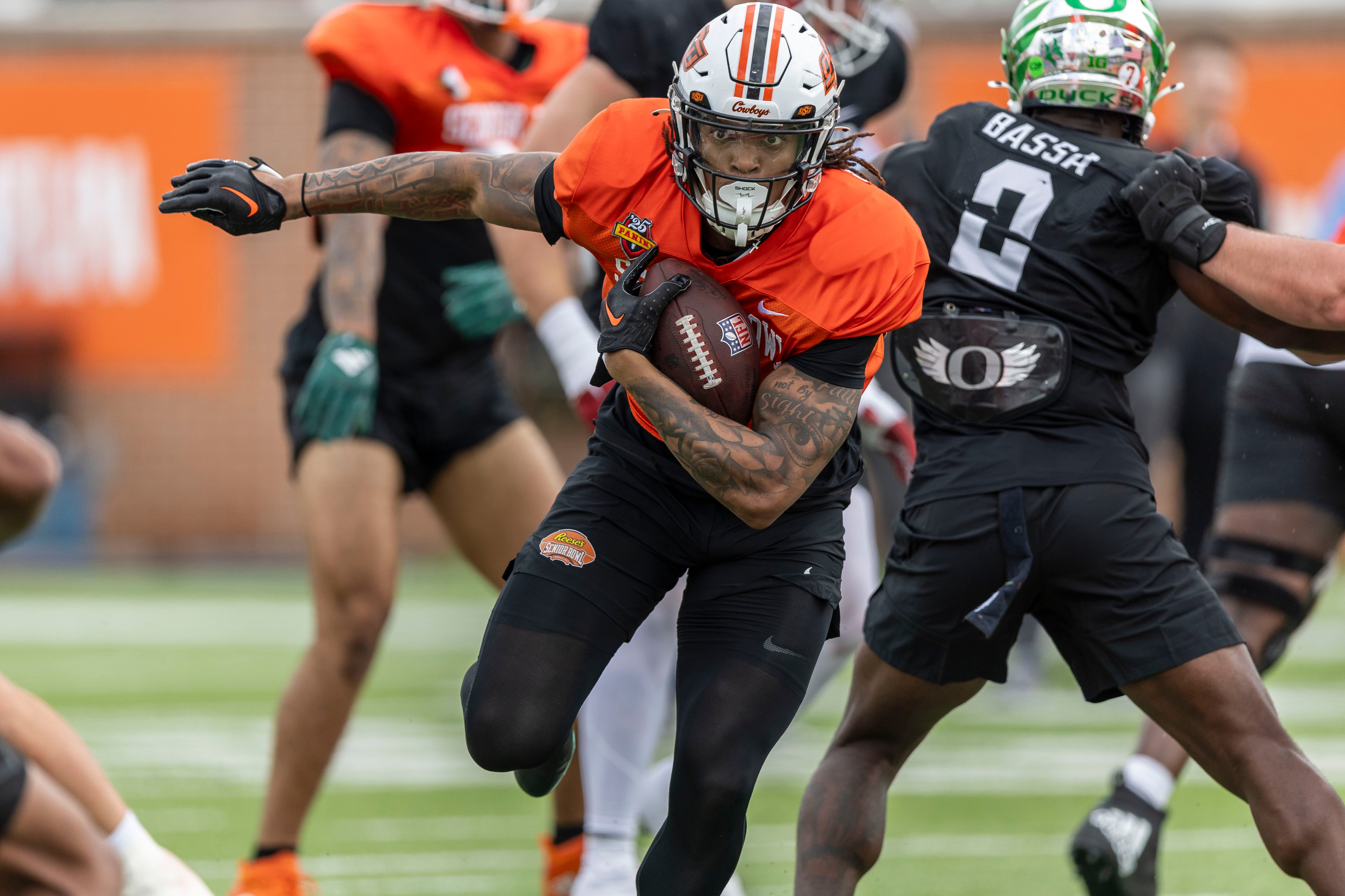 Jan 30, 2025; Mobile, AL, USA; National team running back Ollie Gordon II of Oklahoma State (0) runs the ball during Senior Bowl practice for the National team at Hancock Whitney Stadium.