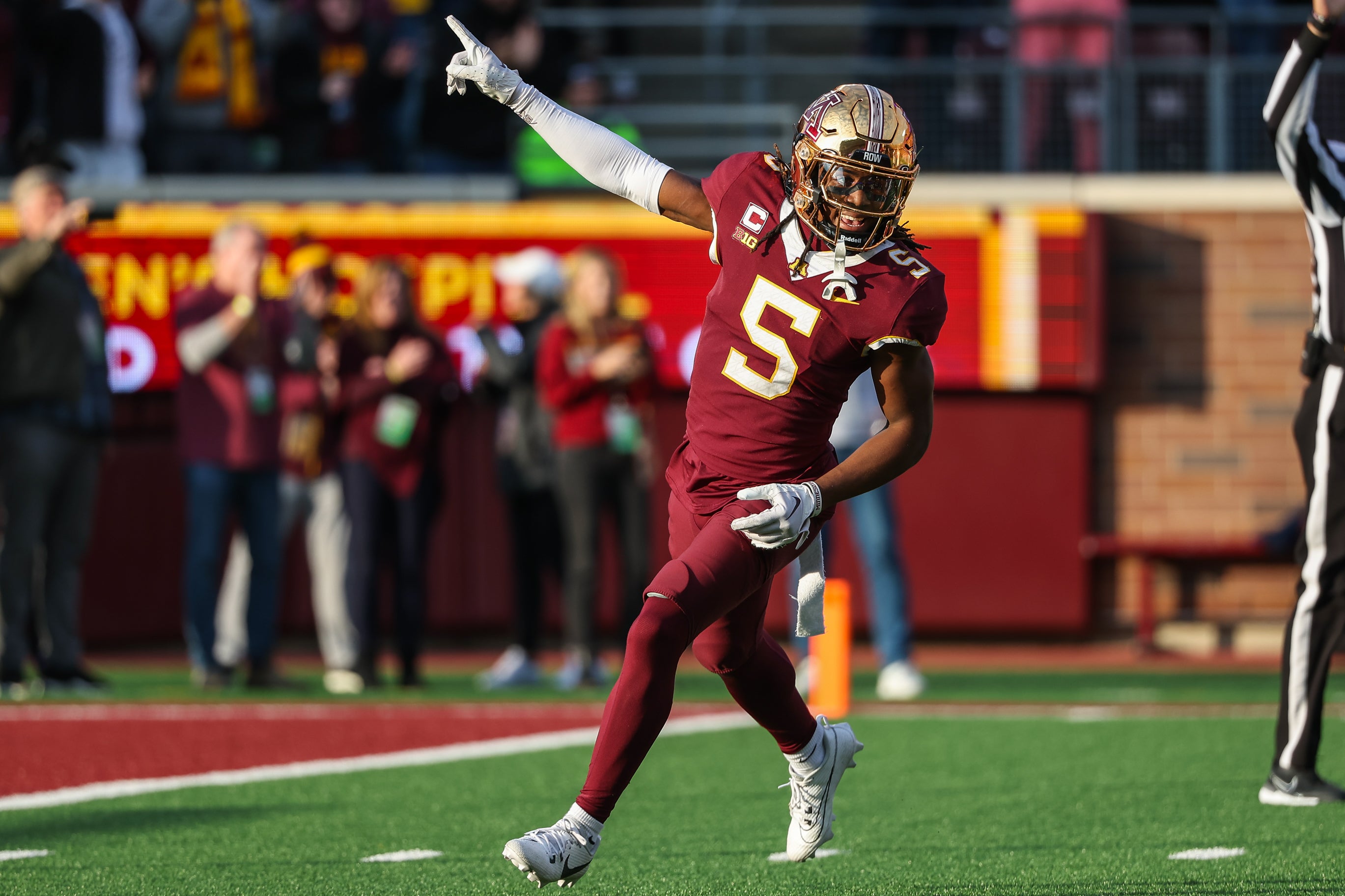 Nov 4, 2023; Minneapolis, Minnesota, USA; Minnesota Golden Gophers defensive back Justin Walley (5) celebrates a fumble recovery by defensive lineman Chris Collins (13) during the second half against the Illinois Fighting Illini at Huntington Bank Stadium.