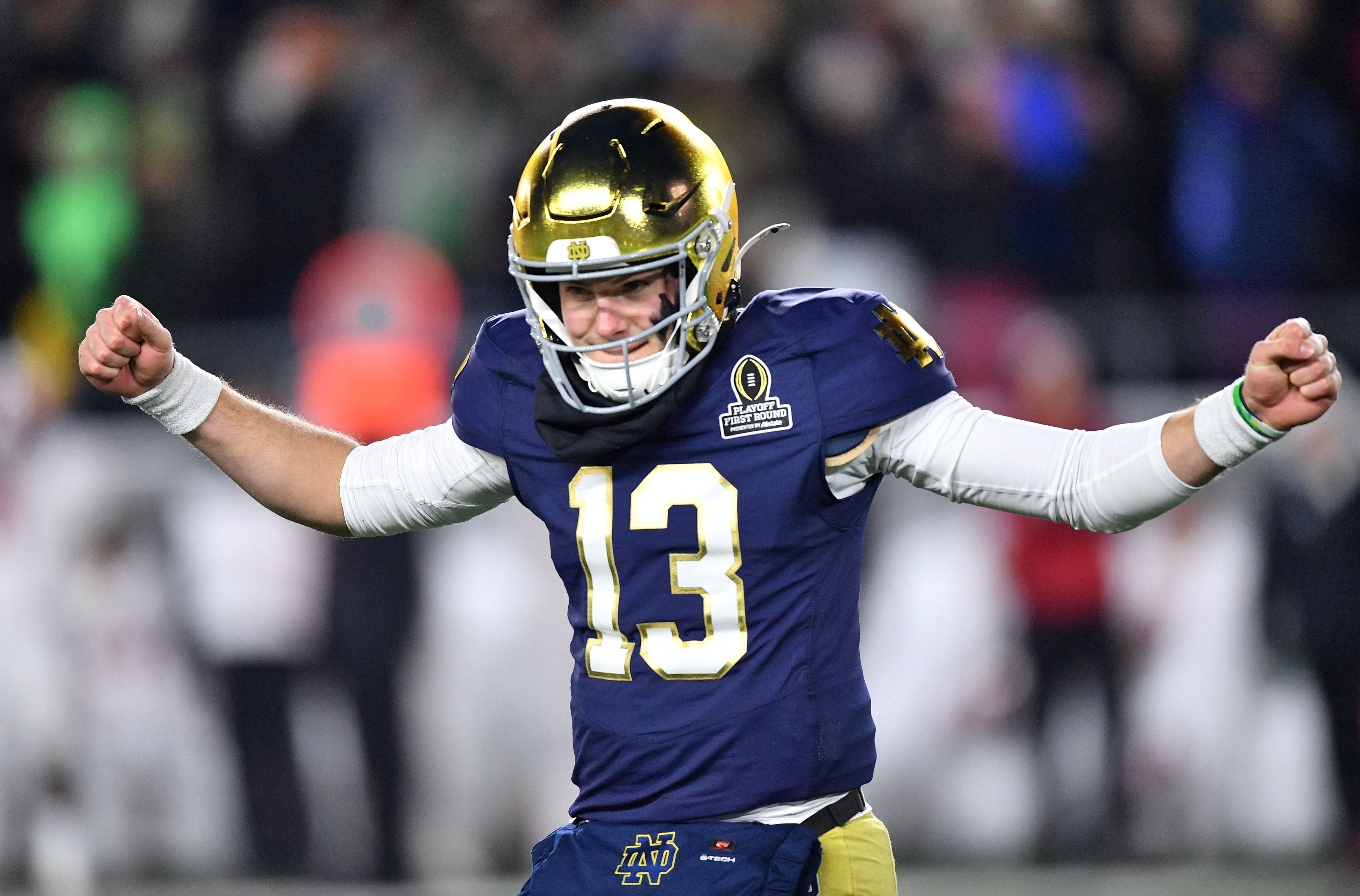 Dec 20, 2024; Notre Dame, Indiana, USA; Notre Dame Fighting Irish quarterback Riley Leonard (13) reacts after a play during the first half against the Indiana Hoosiers at Notre Dame Stadium.