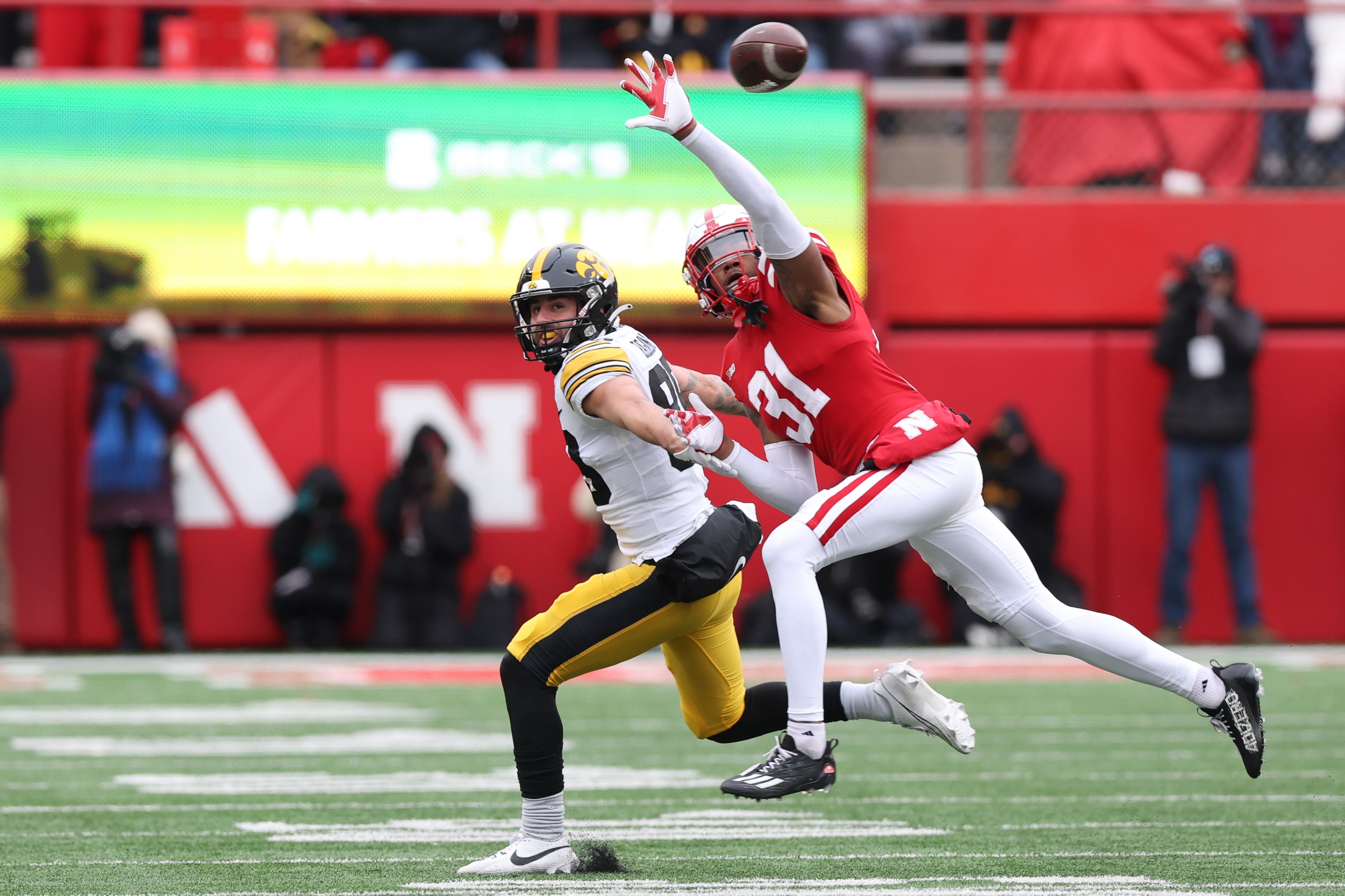 Nov 24, 2023; Lincoln, Nebraska, USA; Nebraska Cornhuskers defensive back Tommi Hill (31) blocks a pass intended for Iowa Hawkeyes wide receiver Nico Ragaini (89) at Memorial Stadium.