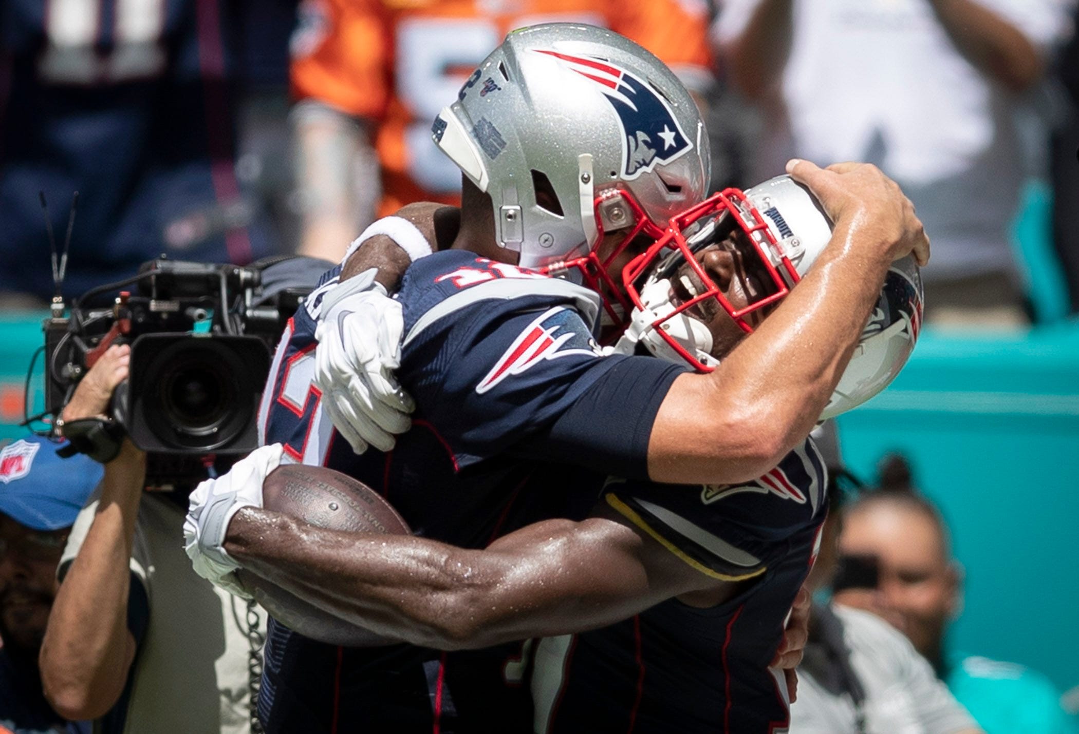 New England Patriots wide receiver Antonio Brown (17) (right) hugs New England Patriots quarterback Tom Brady (12) after catching a touchdown pass in the second quarter in Miami Gardens, September 15, 2019.