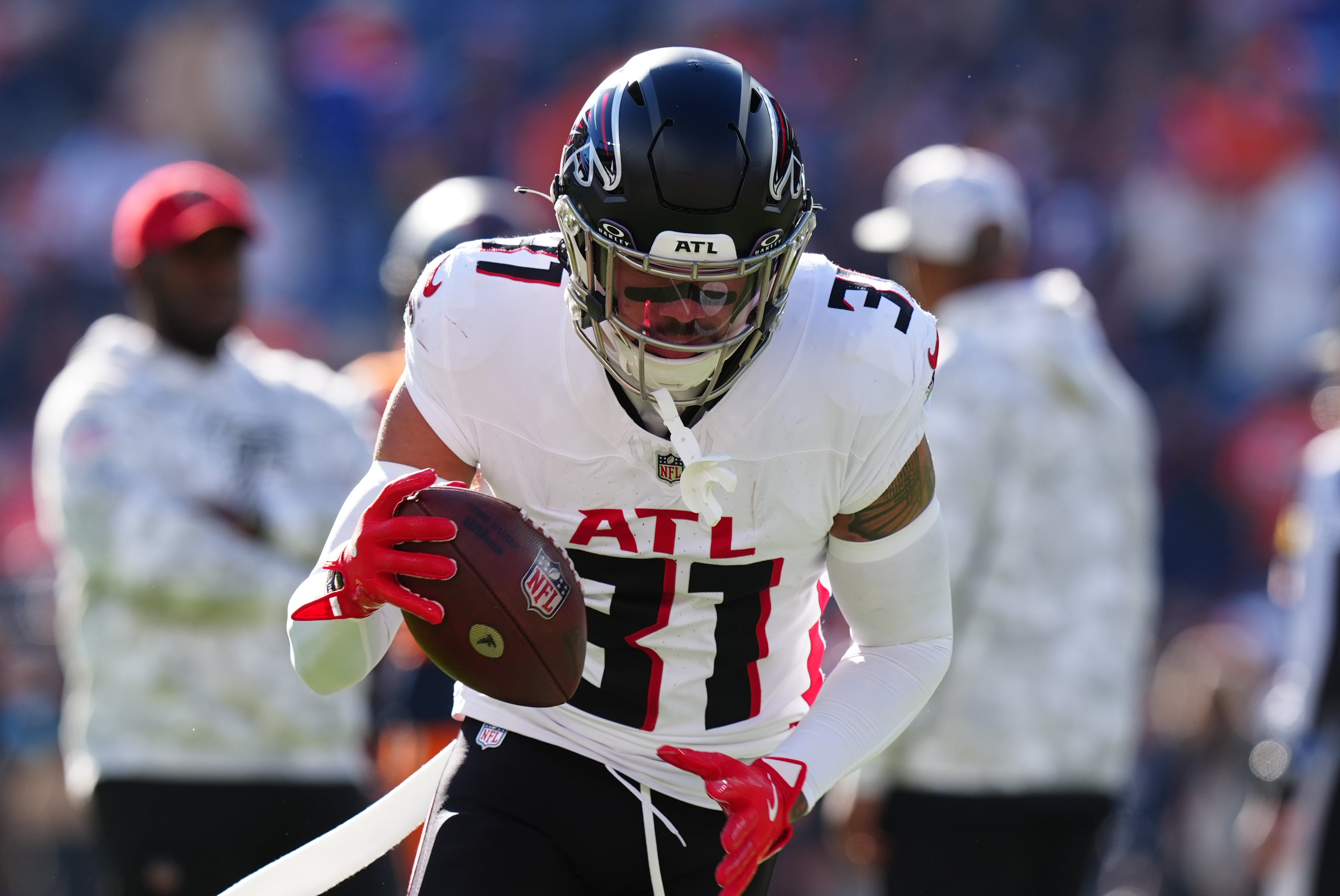 Atlanta Falcons safety Justin Simmons (31) warms up before the game against the Denver Broncos at Empower Field at Mile High.