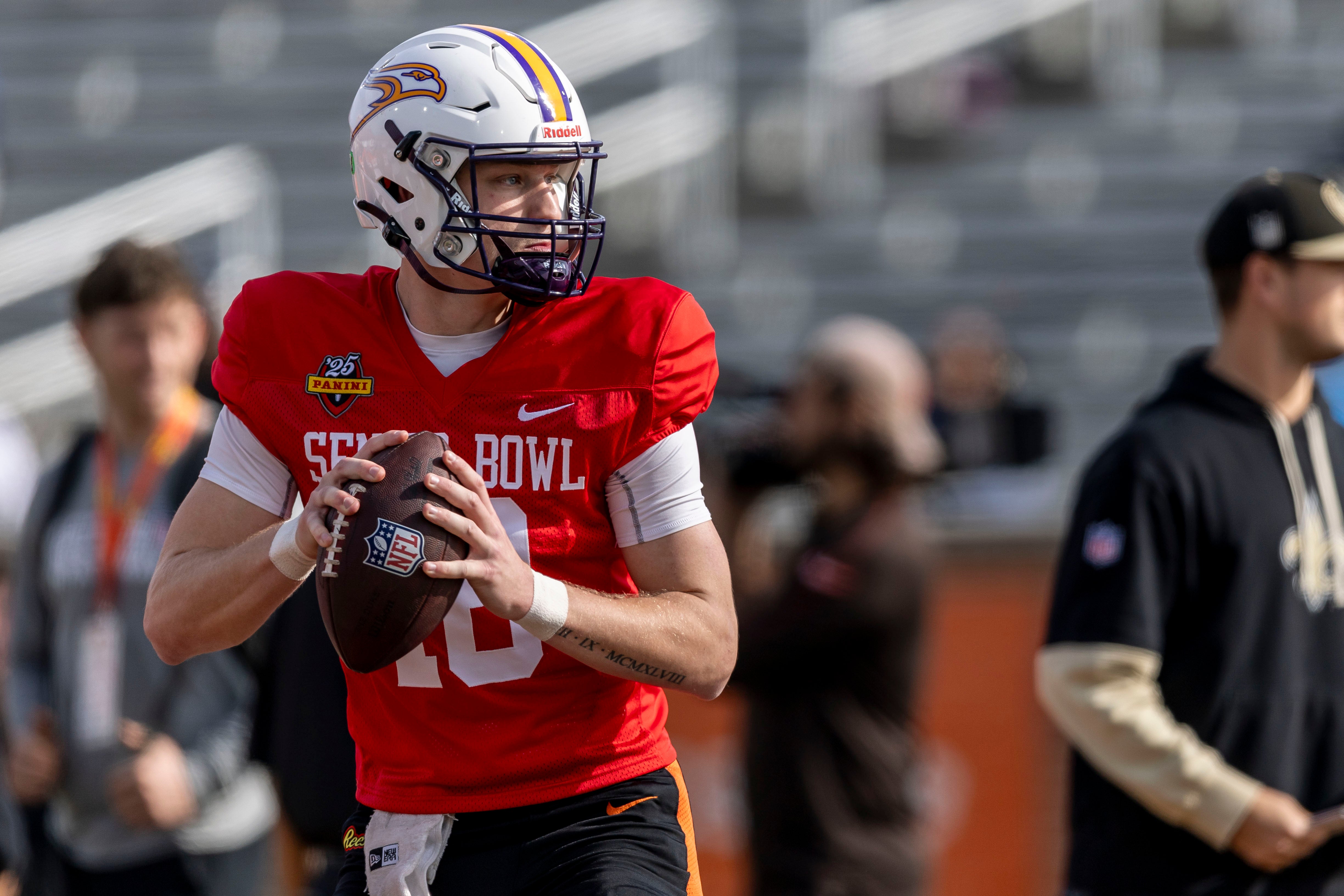 National team quarterback Taylor Elgersma of Laurier (18) drops to pass during Senior Bowl practice for the National team at Hancock Whitney Stadium.