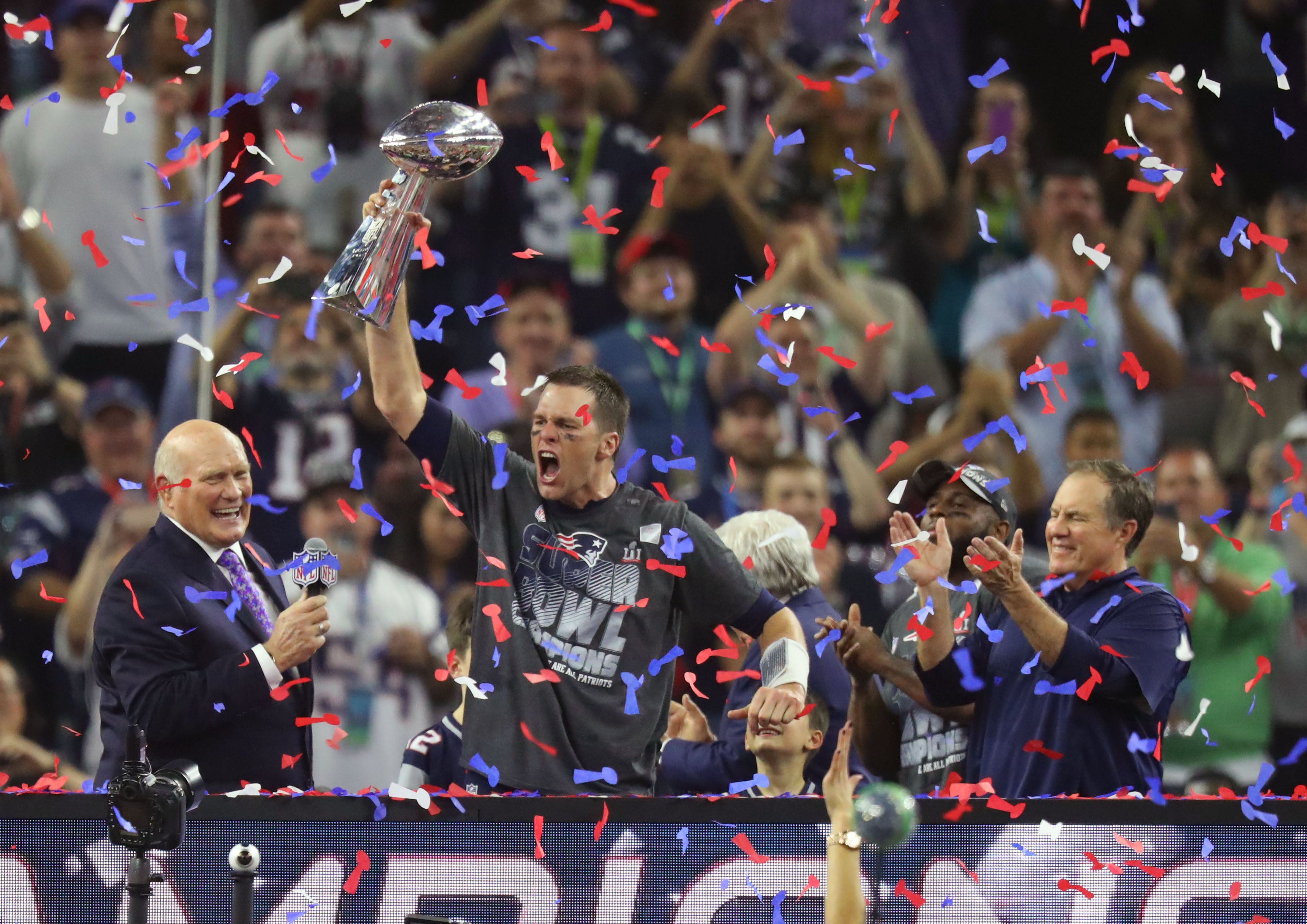 Feb 5, 2017; Houston, TX, USA; New England Patriots quarterback Tom Brady (12) celebrates with the Vince Lombardi Trophy after winning Super Bowl LI against the Atlanta Falcons at NRG Stadium.