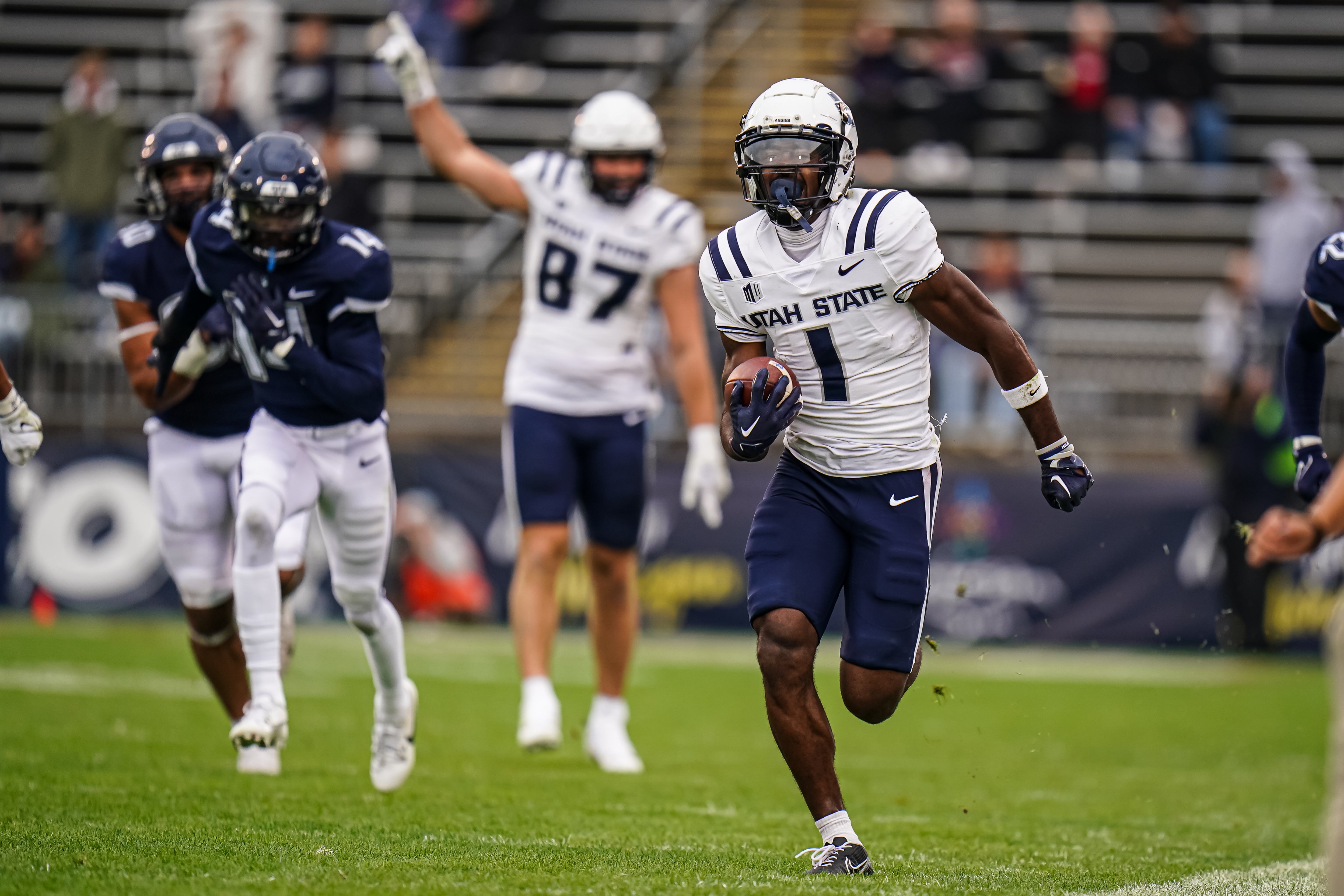 Sep 30, 2023; East Hartford, Connecticut, USA; Utah State Aggies wide receiver Jalen Royals (1) runs the ball for a touchdown against the UConn Huskies in the second half at Rentschler Field at Pratt & Whitney Stadium.
