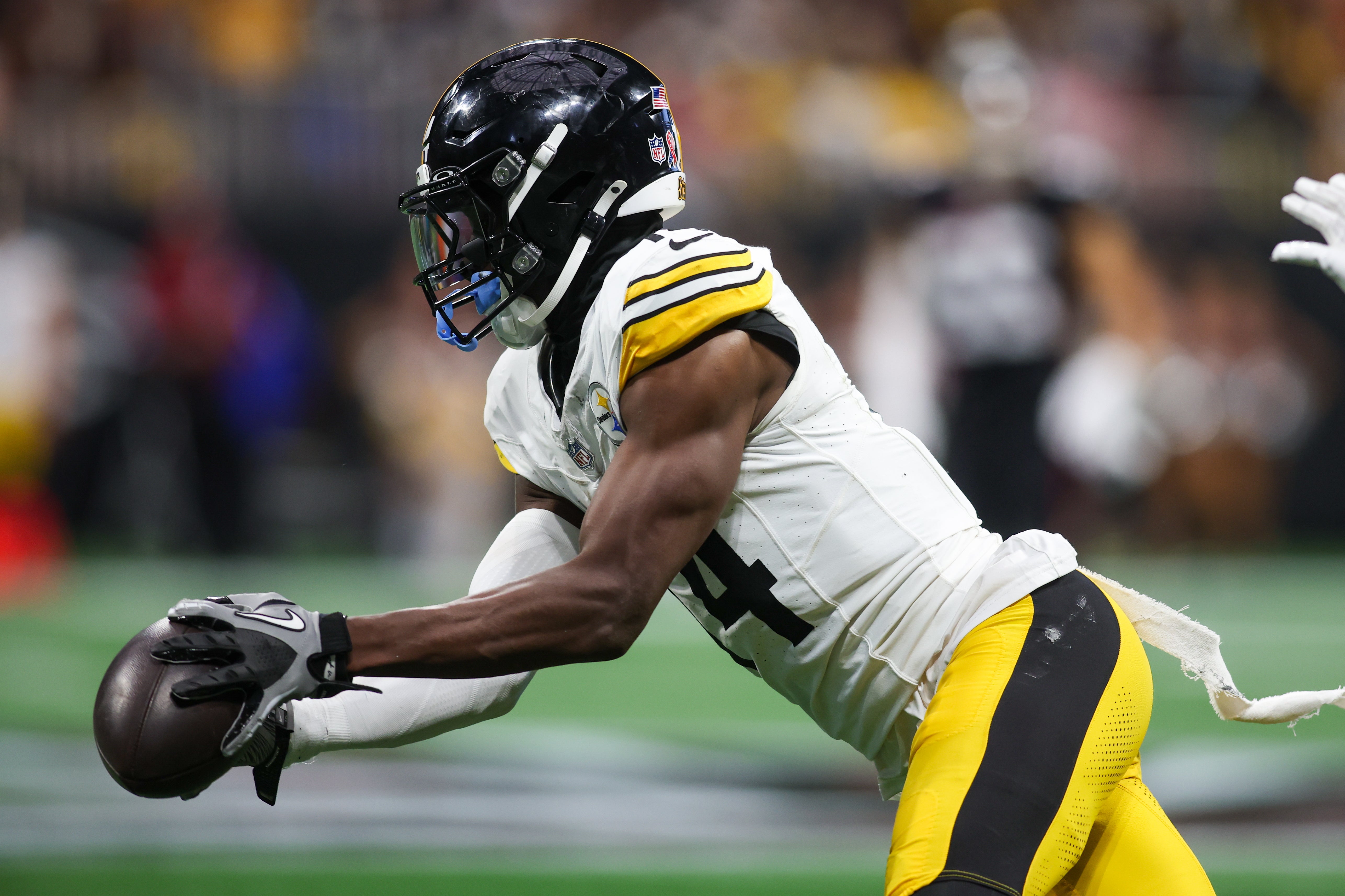 Sep 8, 2024; Atlanta, Georgia, USA; Pittsburgh Steelers wide receiver George Pickens (14) catches a pass against the Atlanta Falcons in the third quarter at Mercedes-Benz Stadium.