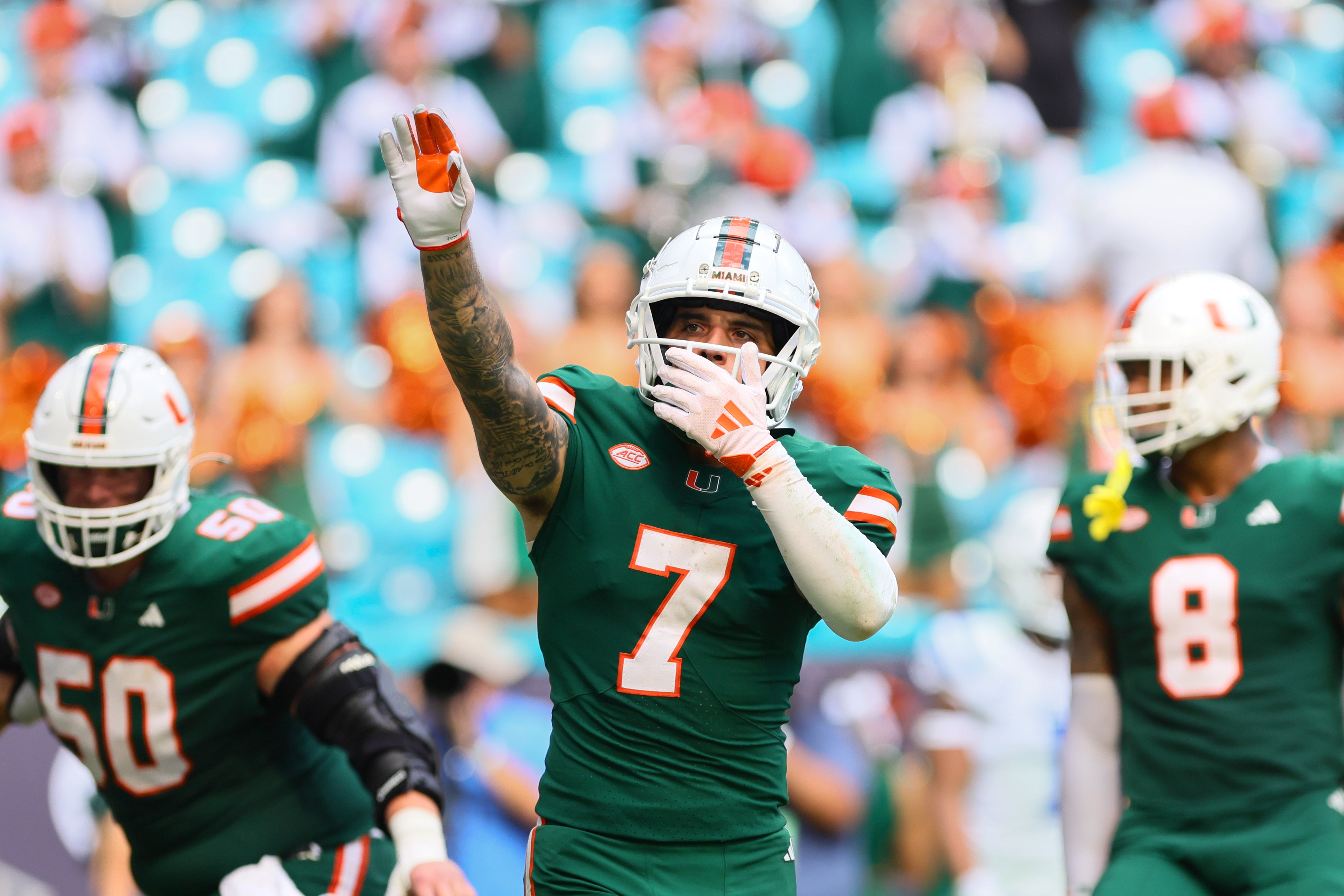 Nov 2, 2024; Miami Gardens, Florida, USA; Miami Hurricanes wide receiver Xavier Restrepo (7) celebrates after a touchdown by wide receiver Jacolby George (not pictured) against the Duke Blue Devils during the fourth quarter at Hard Rock Stadium. Mandatory Credit: Sam Navarro-Imagn Images