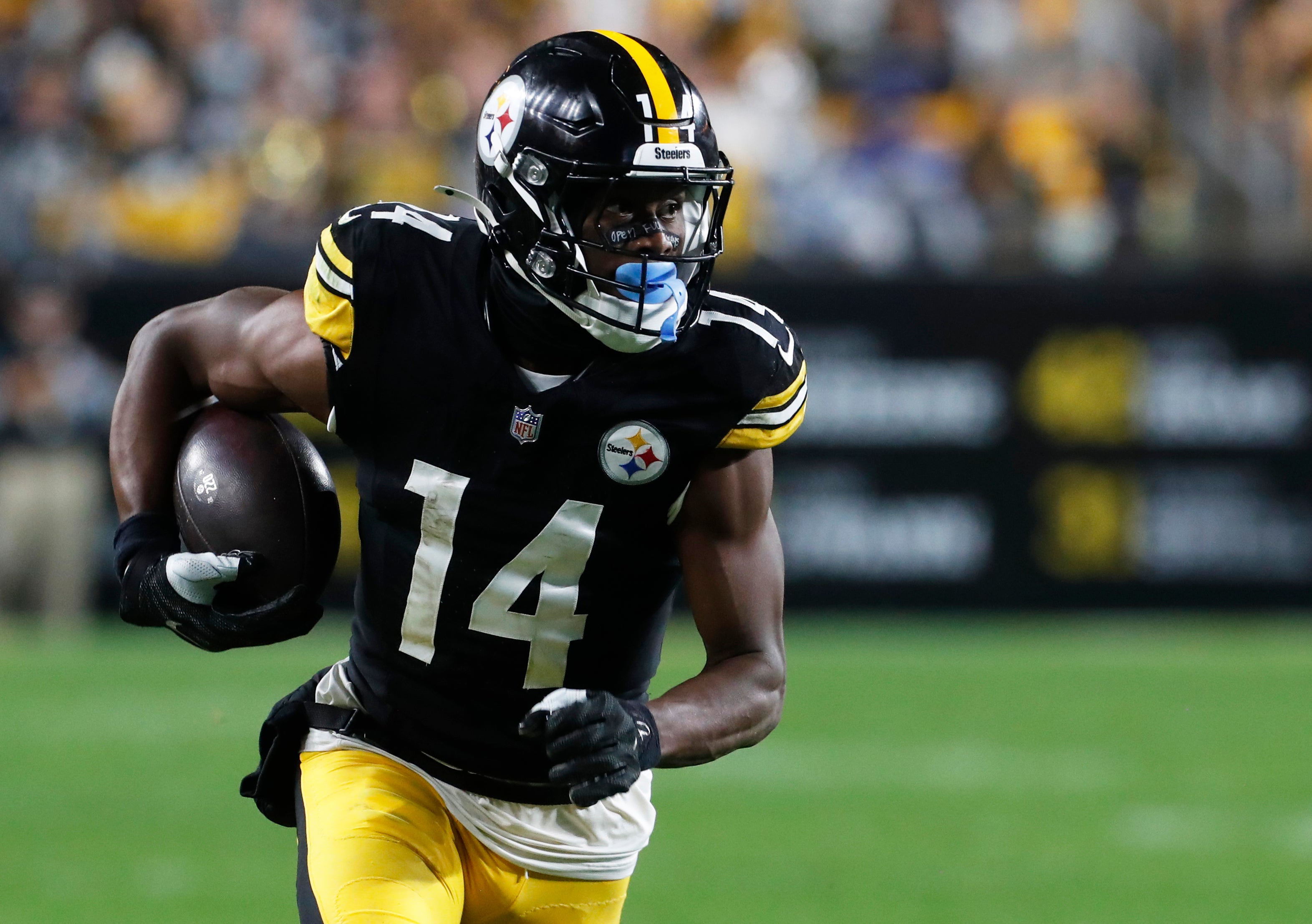 Oct 6, 2024; Pittsburgh, Pennsylvania, USA; Pittsburgh Steelers wide receiver George Pickens (14) runs after a catch against the Dallas Cowboys during the fourth quarter at Acrisure Stadium. Dallas won 20-17.