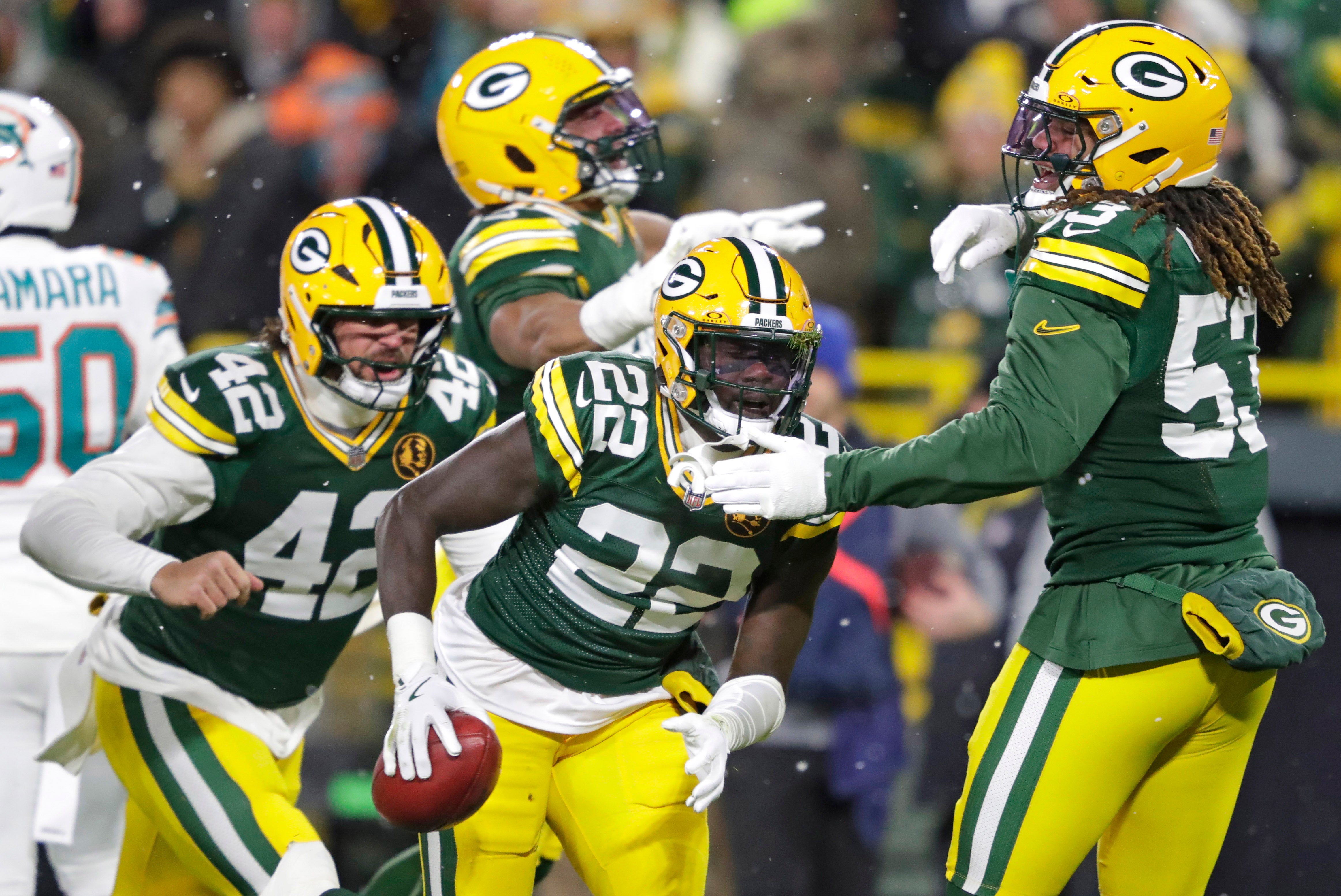 Green Bay Packers cornerback Robert Rochell (22) recovers a fumble on a punt return against the Miami Dolphins in the first half at Lambeau Field.