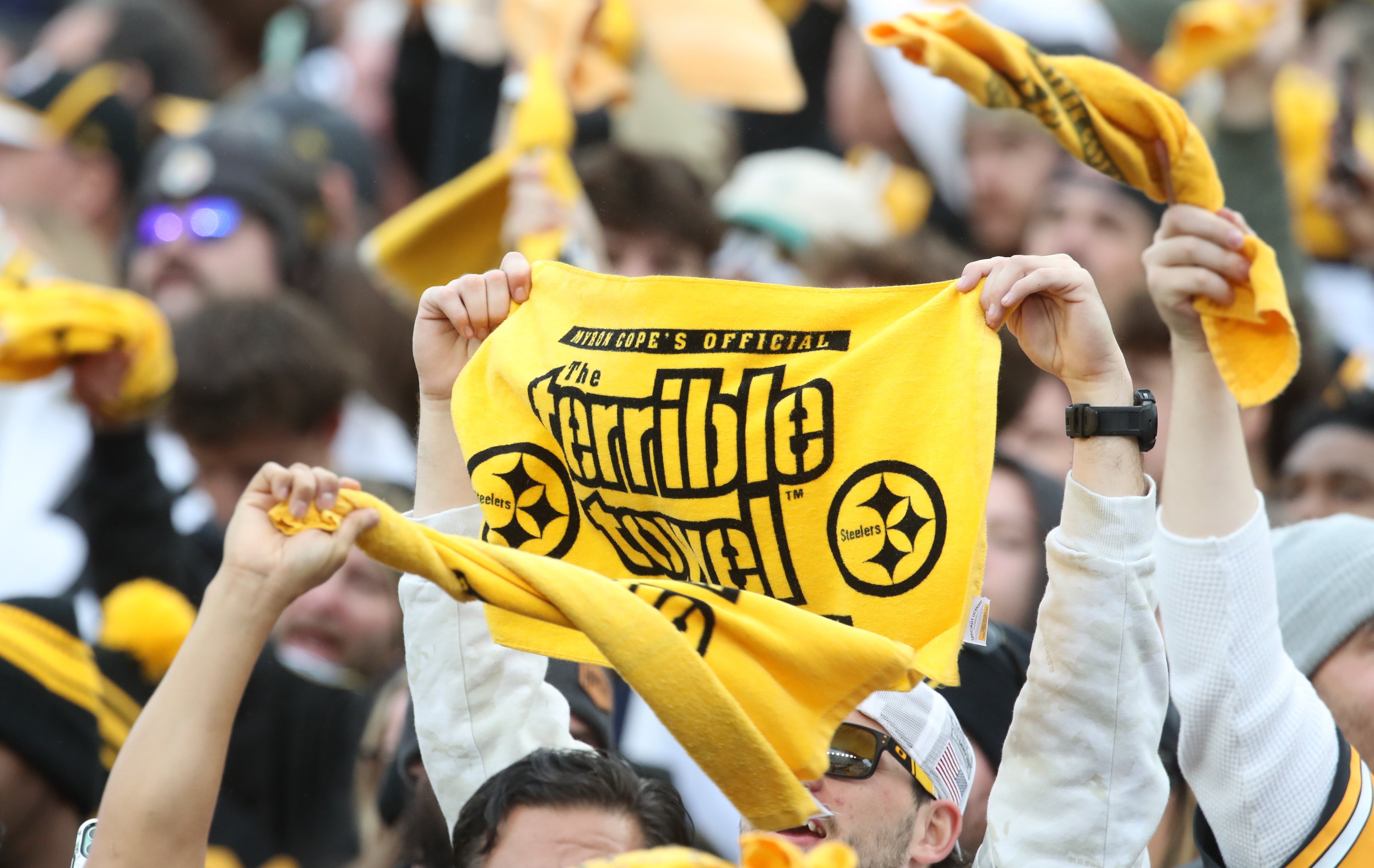 Nov 17, 2024; Pittsburgh, Pennsylvania, USA; Pittsburgh Steelers fans wave Terrible Towels against the Baltimore Ravens during the fourth quarter at Acrisure Stadium.