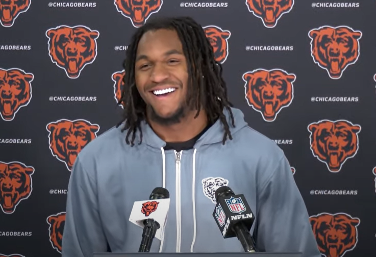 Luther Burden III speaks with reporters following the first day of rookie minicamp.