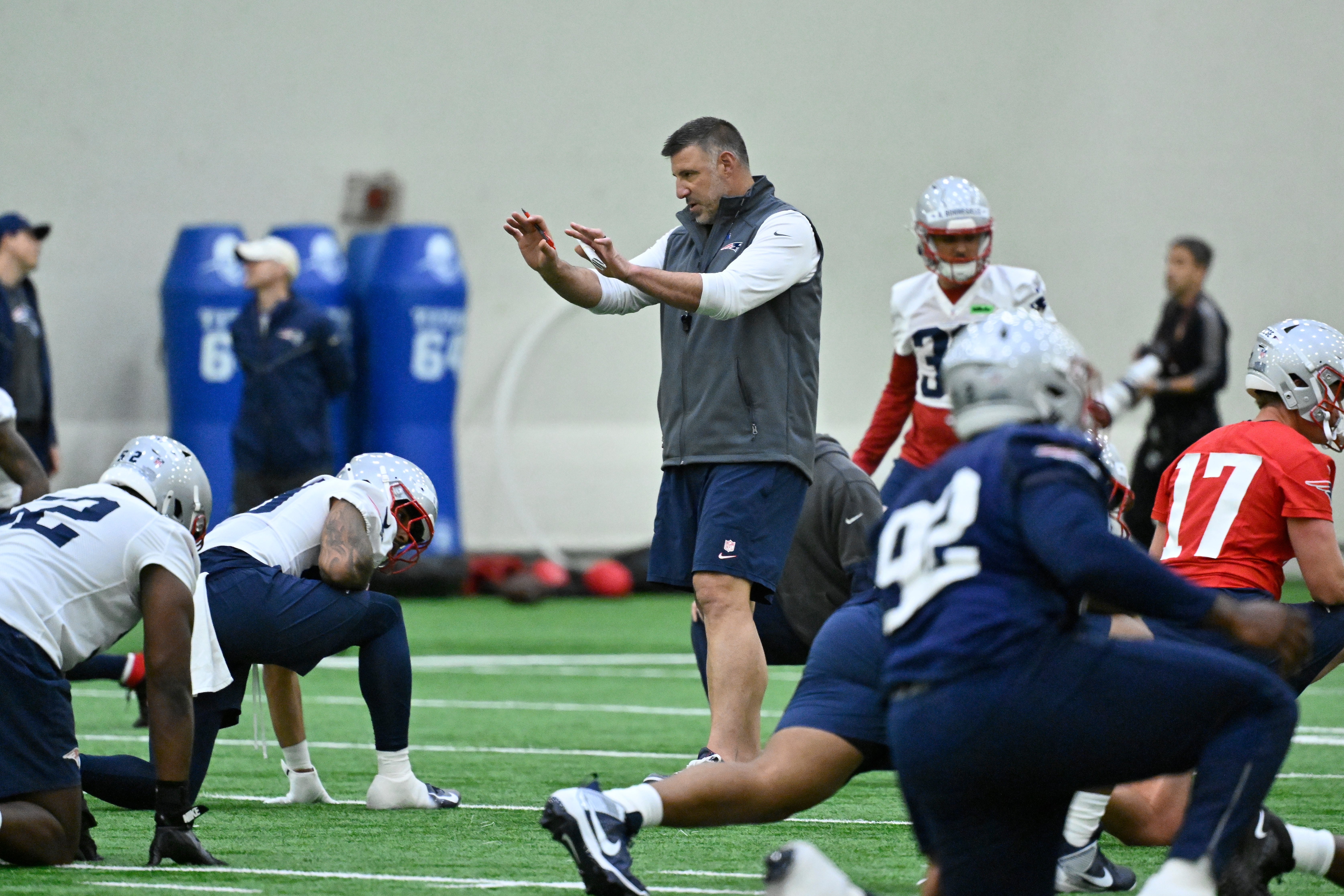 May 9, 2025; Foxborough, MA, USA; New England Patriots head coach Mike Vrabel (c) works with players at rookie camp at Gillette Stadium. 