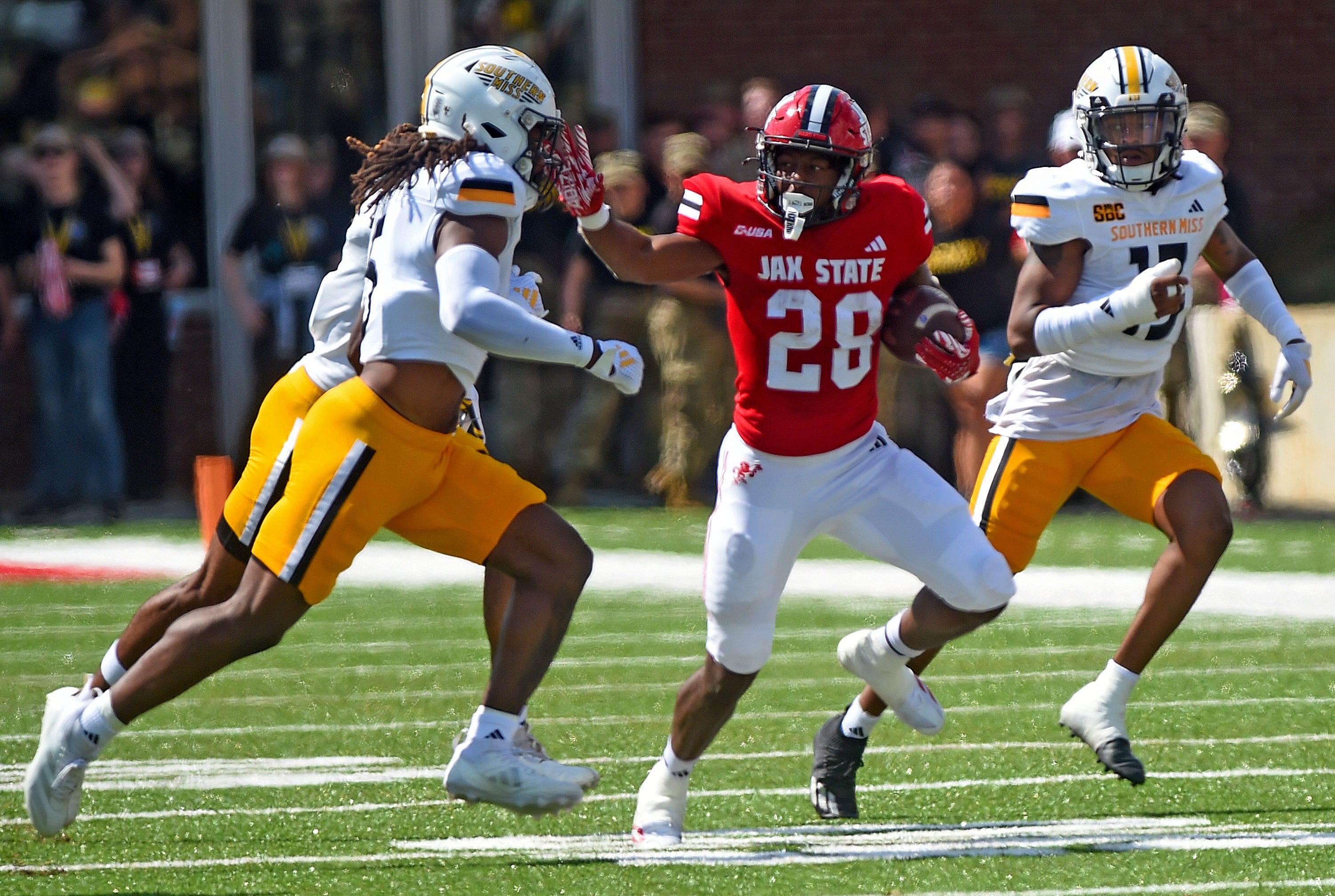 Jacksonville State's Tre Stewart tries to evade the tackle of Southern Miss' Jay Jones during college football action at Burgess-Snow Field AmFirst Stadium in Jacksonville, Alabama September 21, 2024.