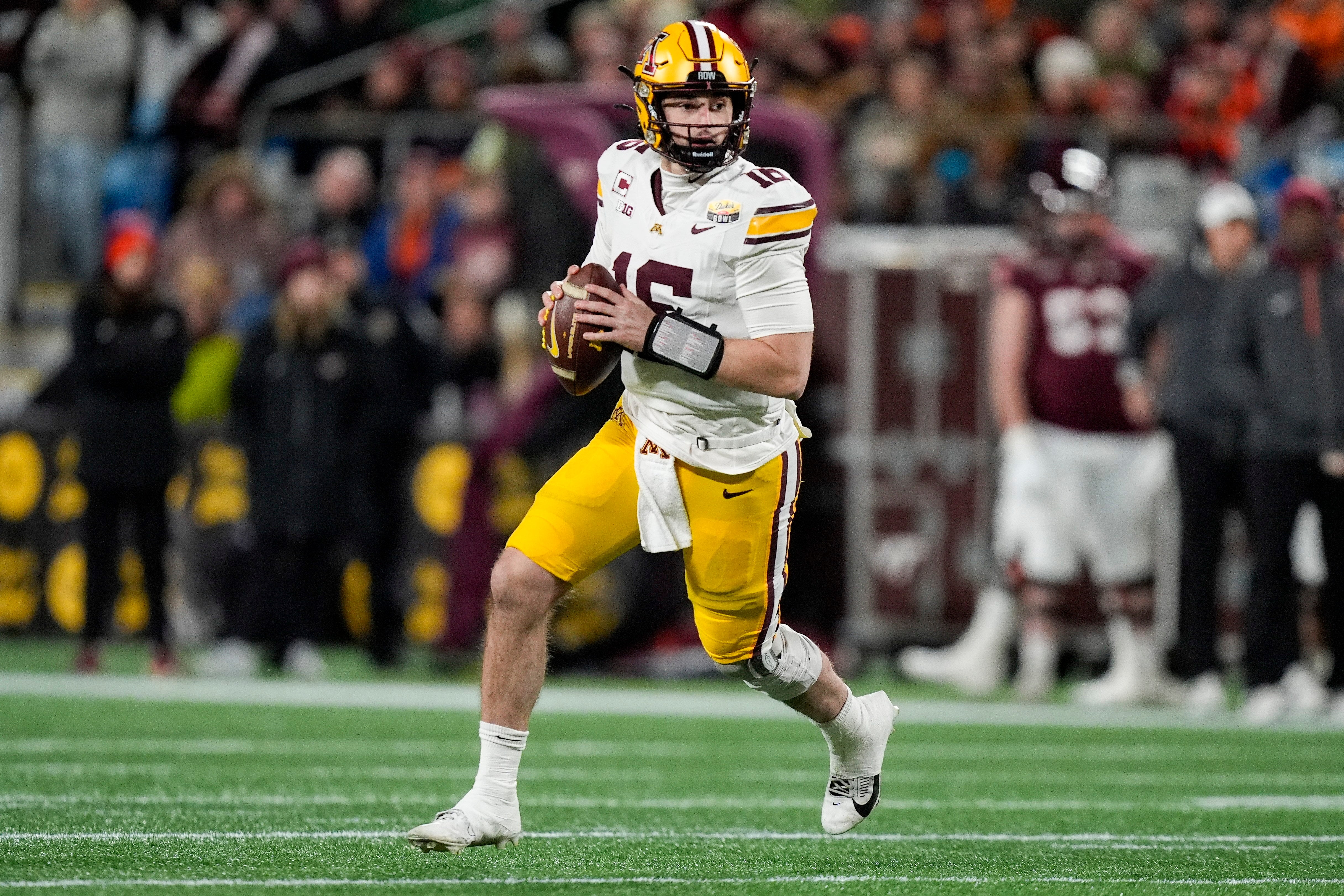 Jan 3, 2025; Charlotte, NC, USA; Minnesota Golden Gophers quarterback Max Brosmer (16) looks to pass against the Virginia Tech Hokies during the second quarter at the Duke’s Mayo Bowl at Bank of America Stadium.