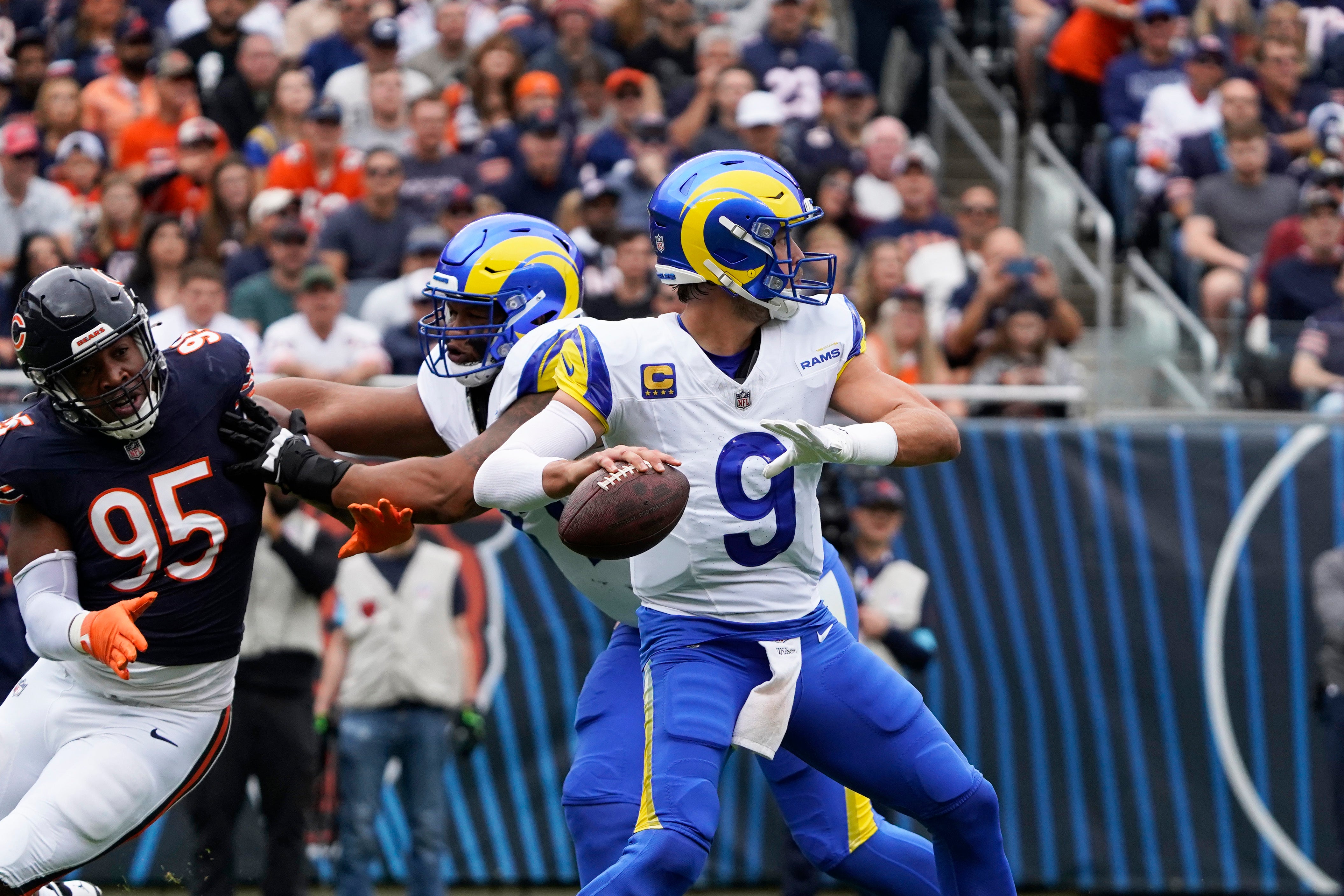 Sep 29, 2024; Chicago, Illinois, USA; Los Angeles Rams quarterback Matthew Stafford (9) passes the ball against the Chicago Bears during the first half at Soldier Field.