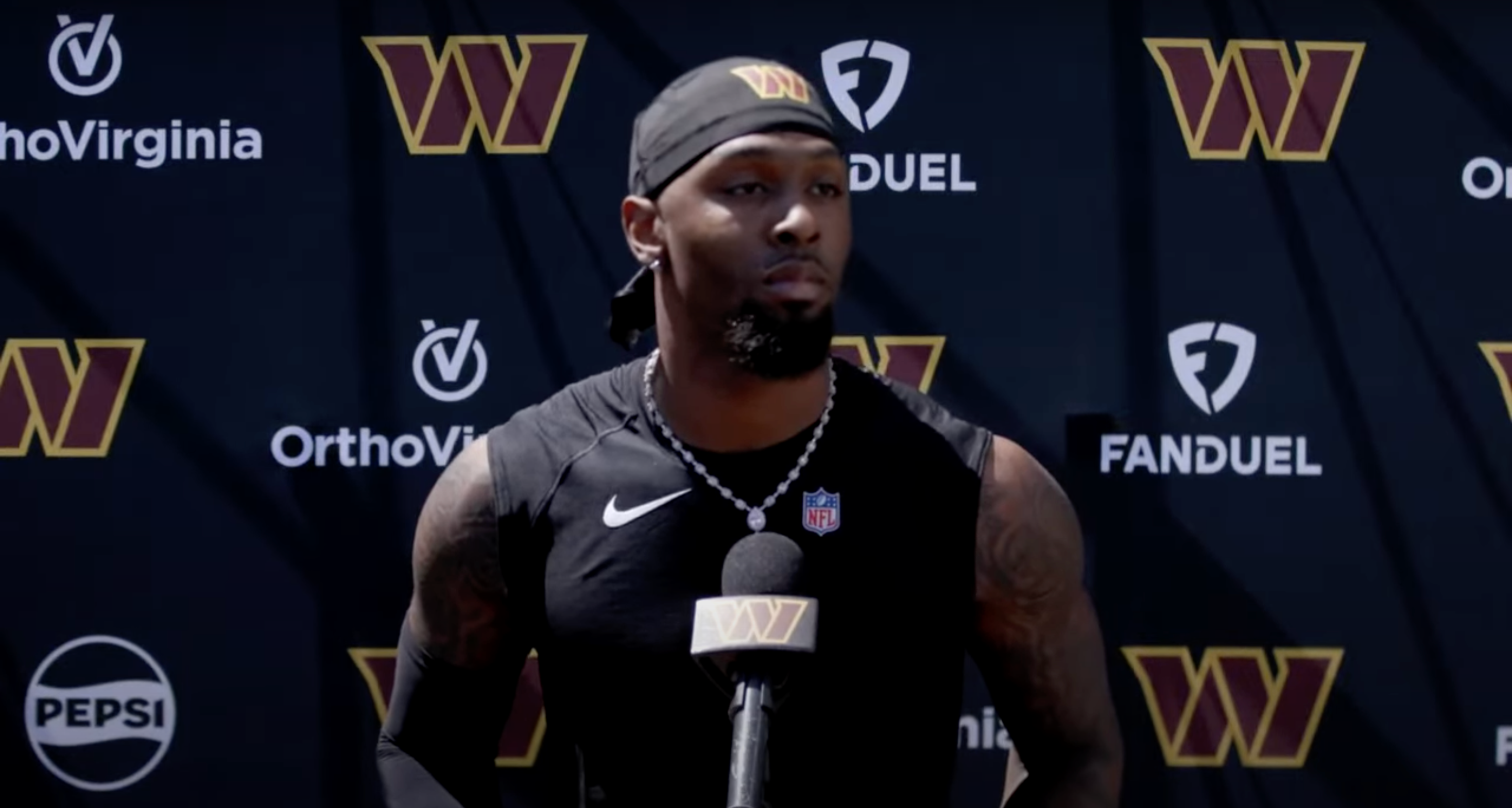 Trey Amos speaks with reporters during Commanders rookie minicamp.