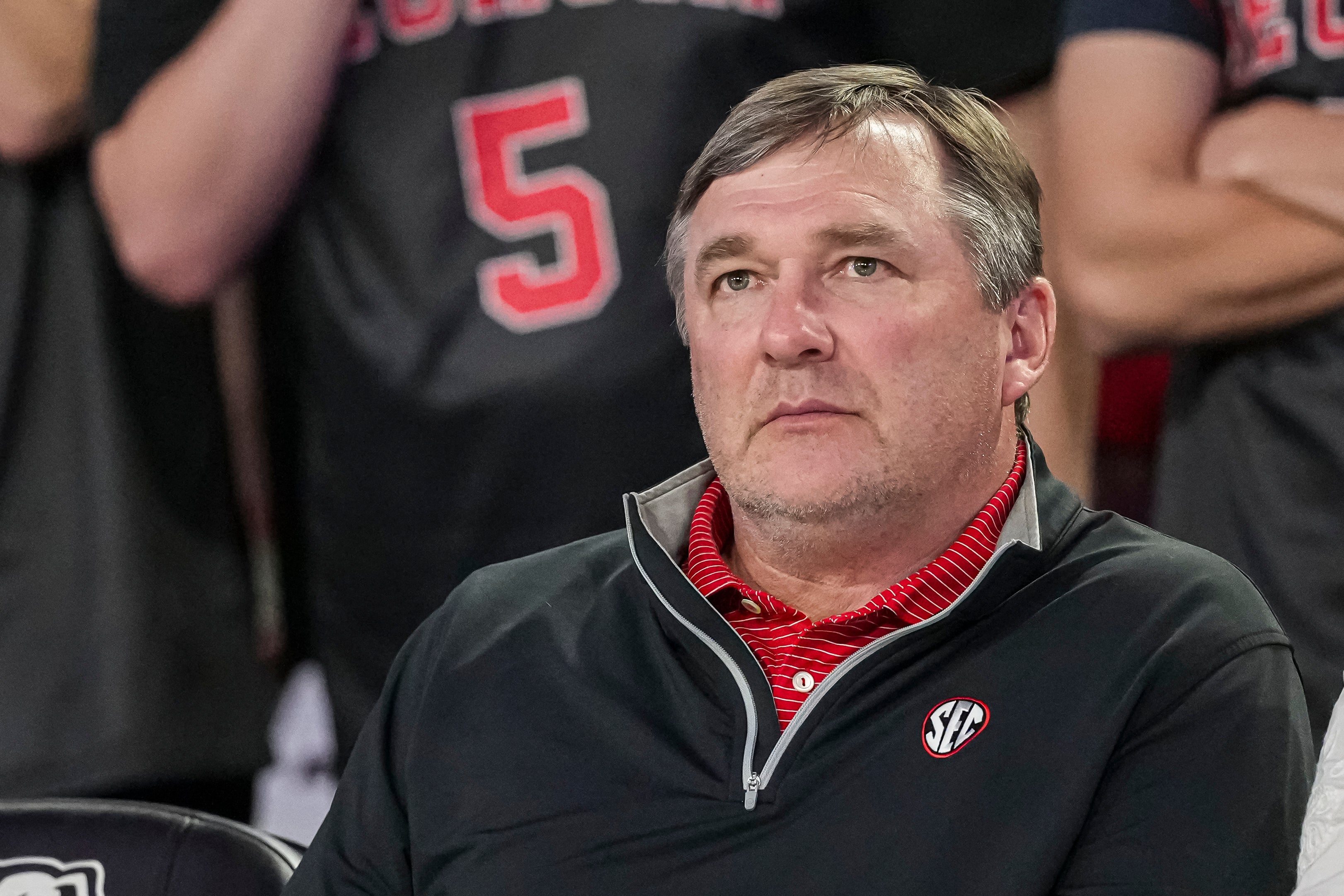 Georgia Bulldogs head football coach Kirby Smart watches the basketball game between Georgia and the Florida Gators during the second half at Stegeman Coliseum.