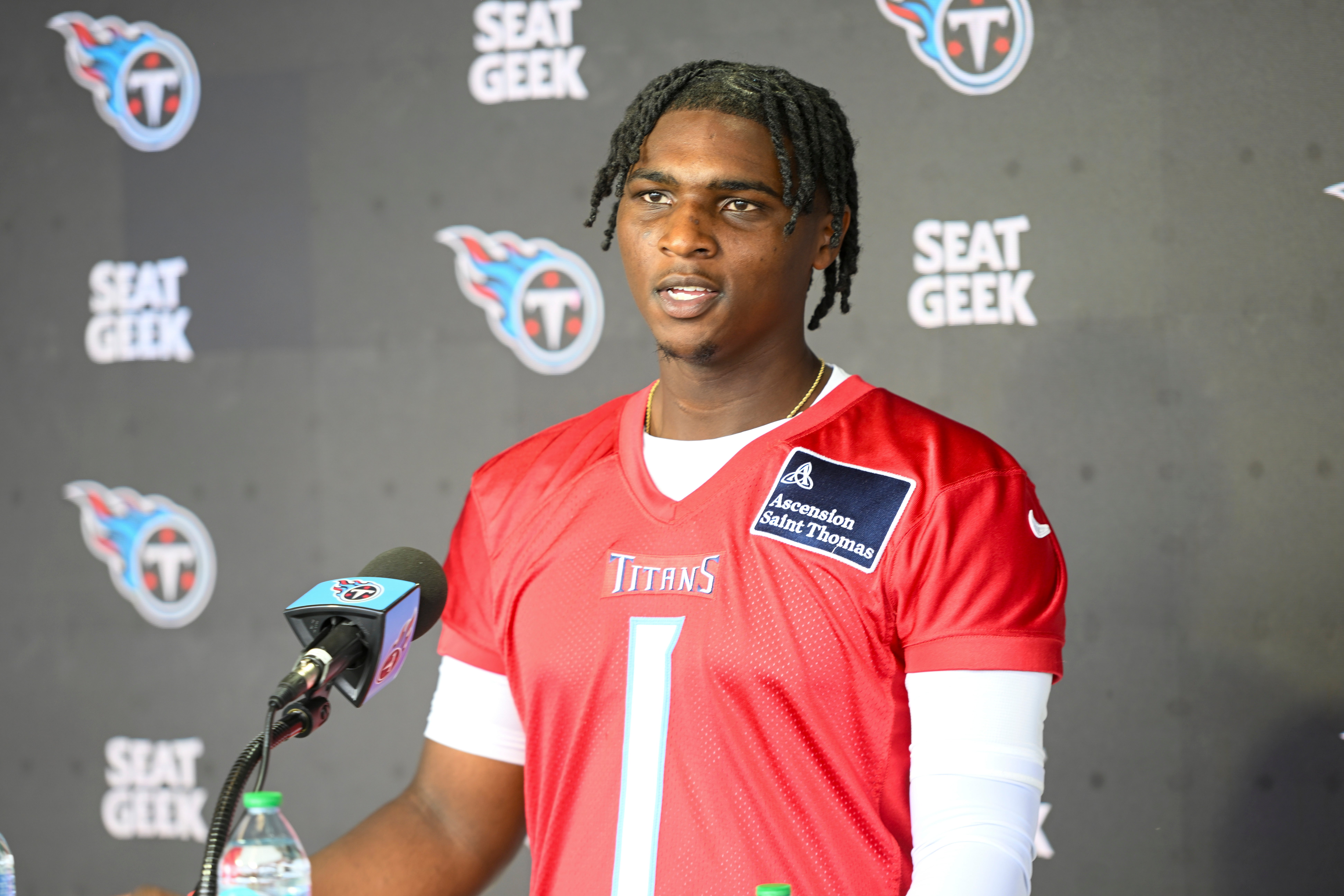 May 10, 2025; Nashville, TN, USA; Tennessee Titans quarterback Cam Ward (1) talks with reporters after his first day of rookie mini camp at Saint Thomas Sports Park. Mandatory Credit: Steve Roberts-Imagn Images