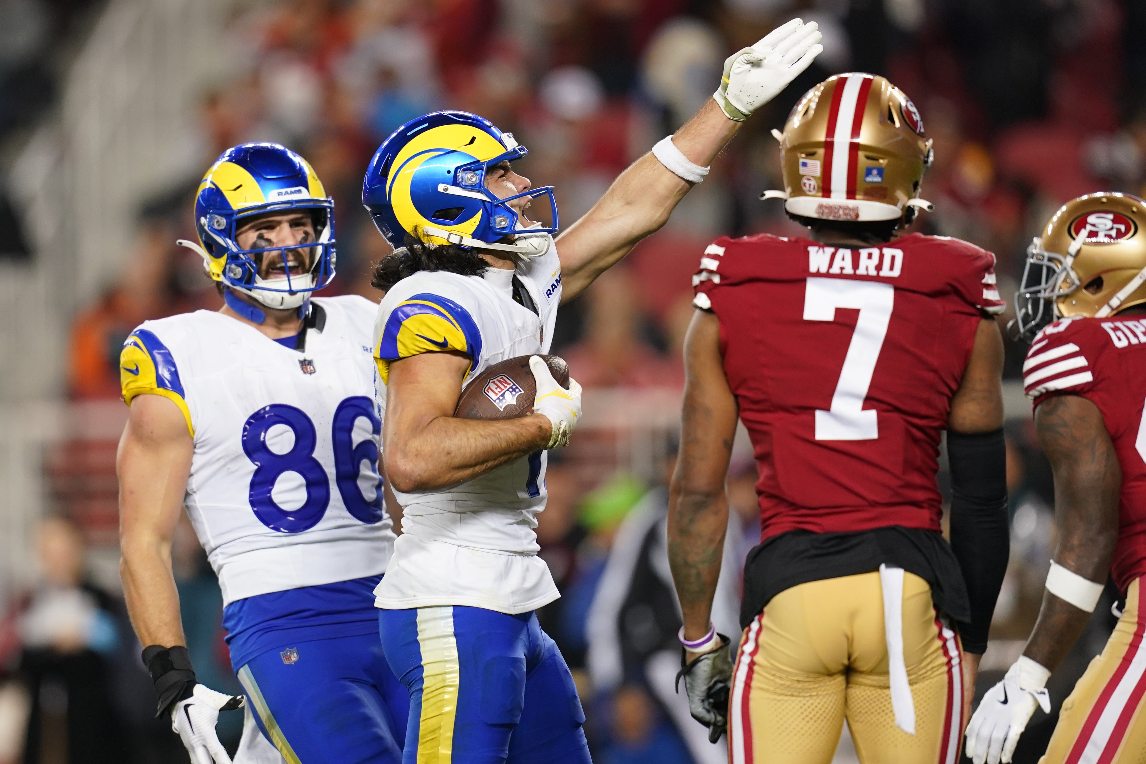 Dec 12, 2024; Santa Clara, California, USA; Los Angeles Rams wide receiver Puka Nacua (17) reacts after making a catch for a first down next to San Francisco 49ers cornerback Charvarius Ward (7) in the fourth quarter at Levi's Stadium.