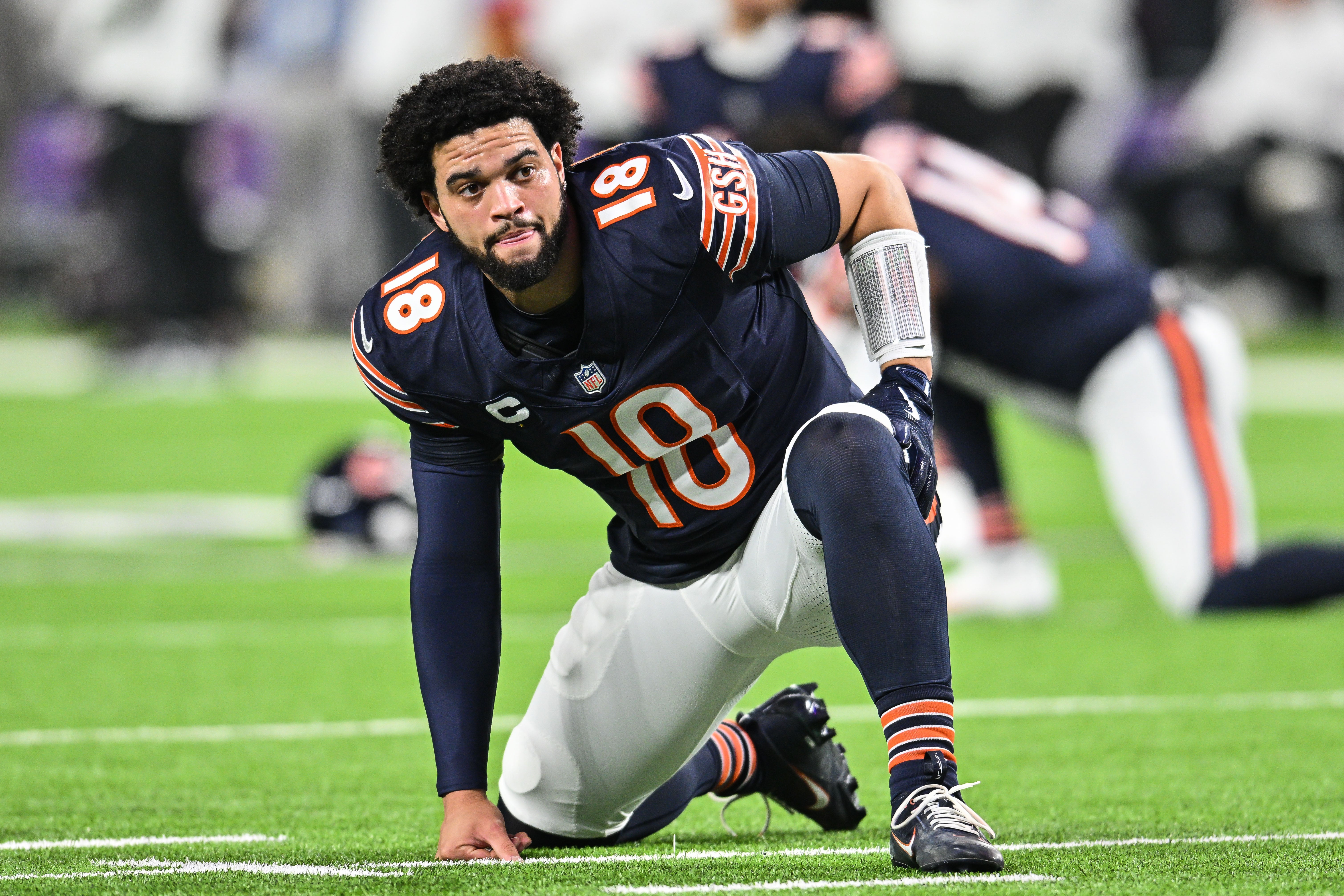 Dec 16, 2024; Minneapolis, Minnesota, USA; Chicago Bears quarterback Caleb Williams (18) looks on before the game against the Minnesota Vikings at U.S. Bank Stadium.