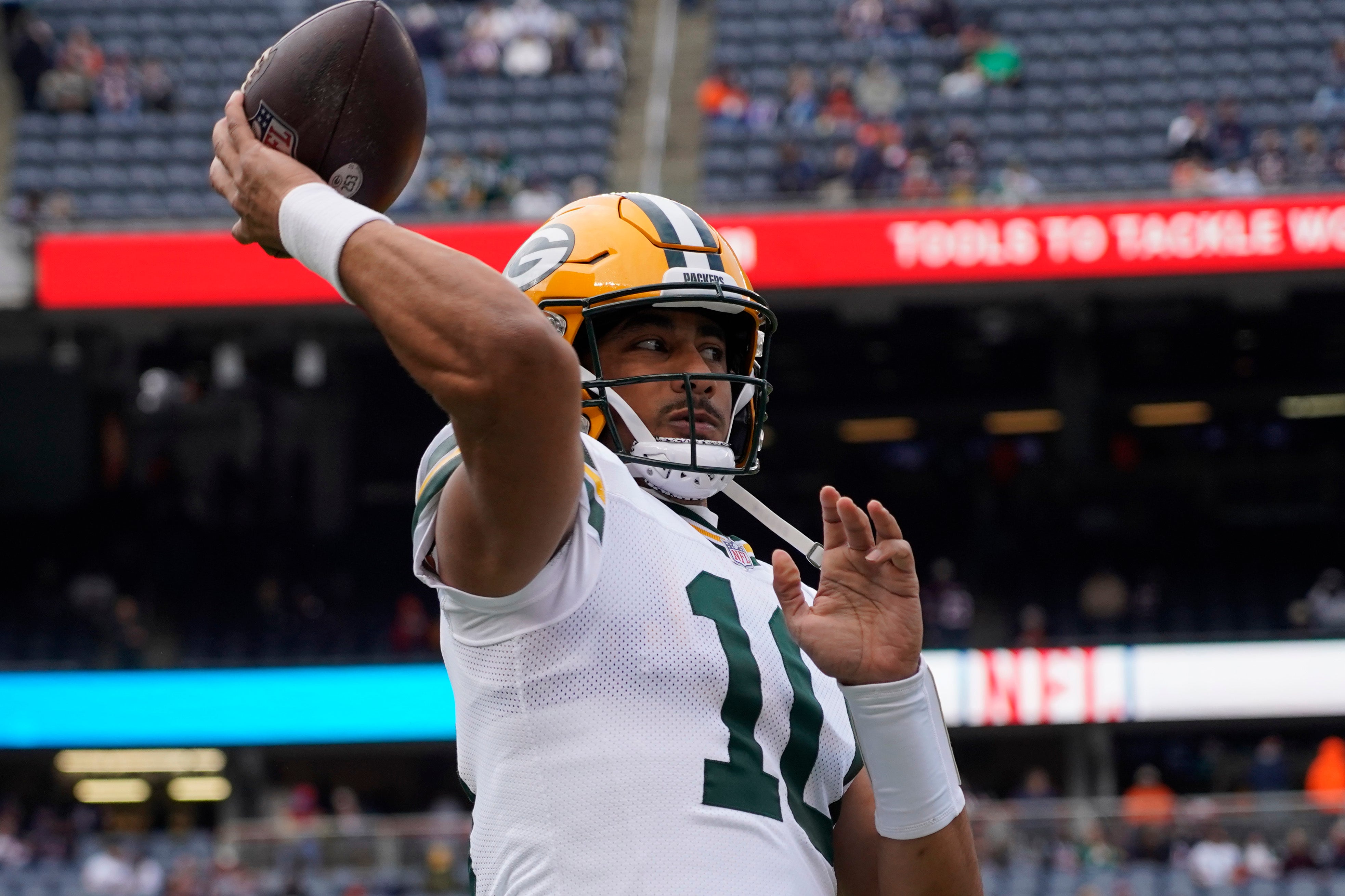 Green Bay Packers quarterback Jordan Love (10) warms up before the game against the Chicago Bears at Soldier Field.
