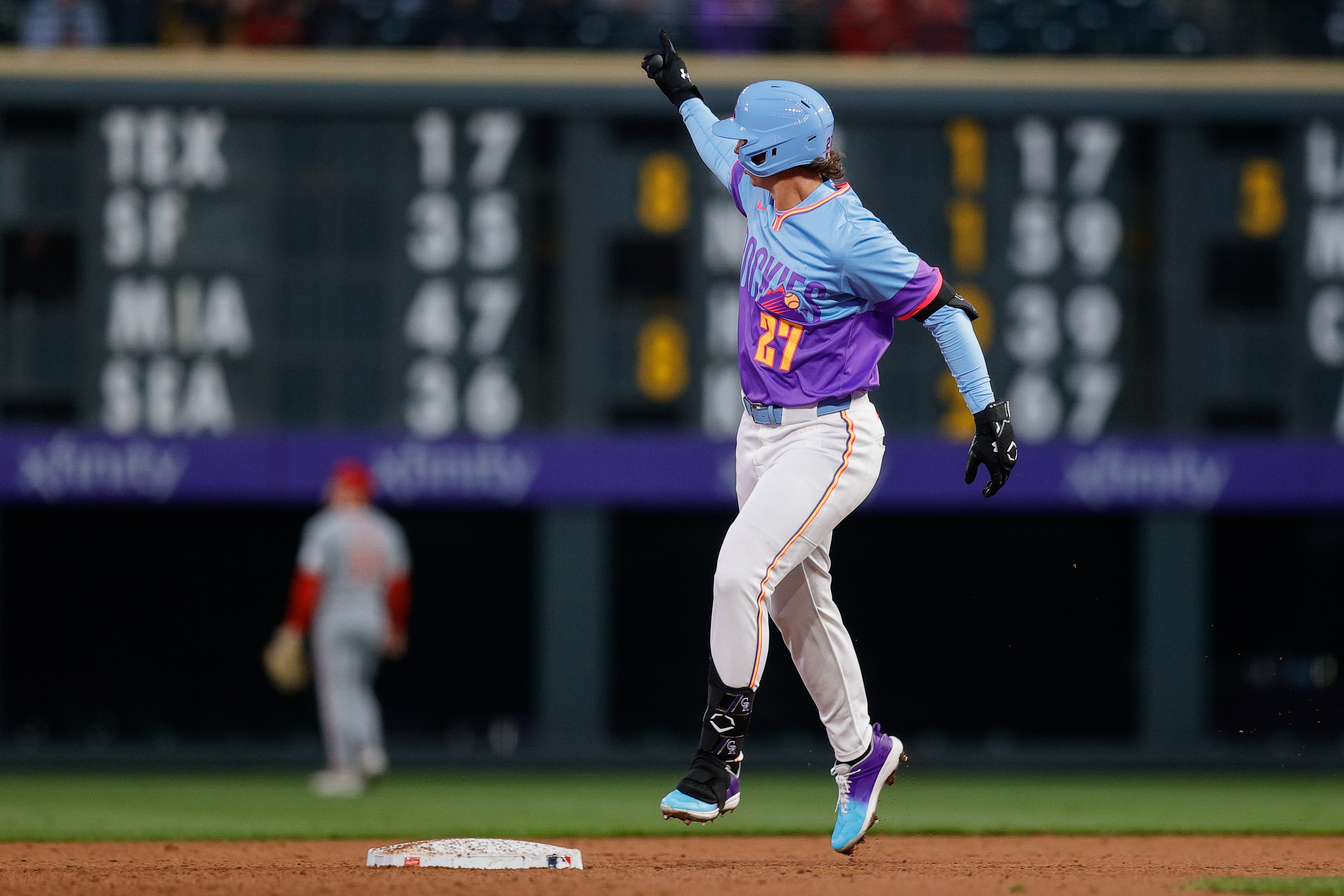 Apr 25, 2025; Denver, Colorado, USA; Colorado Rockies left fielder Jordan Beck (27) gestures as he rounds the bases on a solo home run in the third inning against the Cincinnati Reds at Coors Field.
