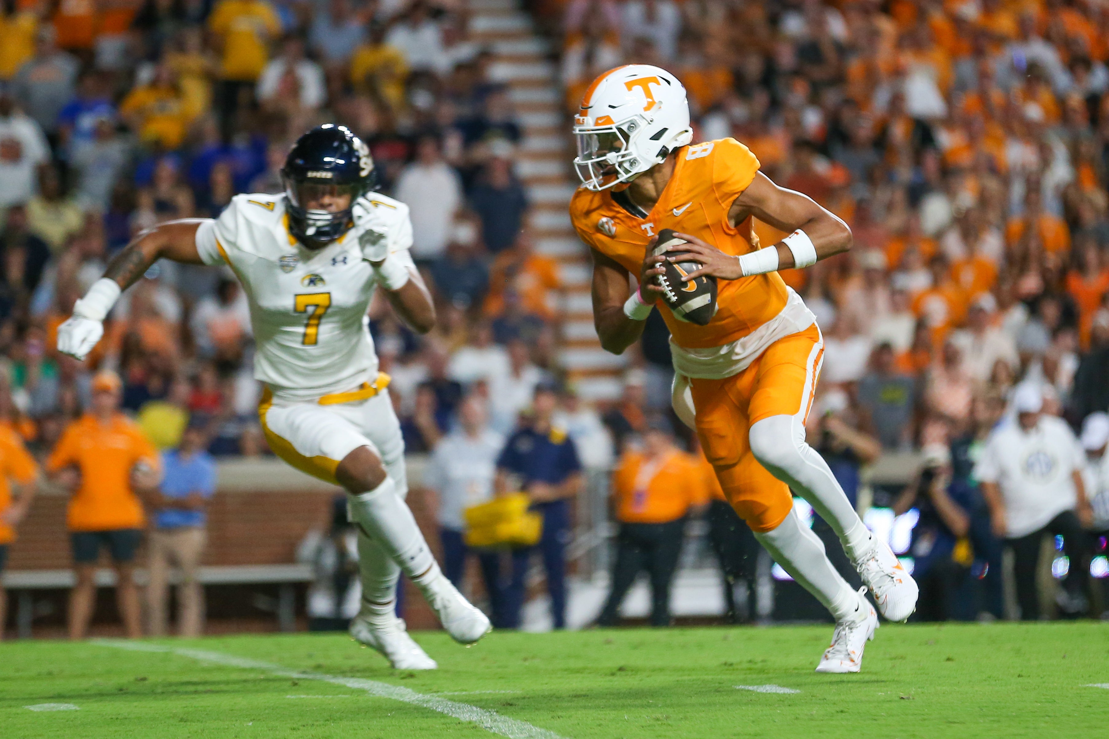 Sep 14, 2024; Knoxville, Tennessee, USA; Tennessee Volunteers quarterback Nico Iamaleava (8) runs the ball against Kent State Golden Flashes linebacker Matt Harmon (7) at Neyland Stadium.