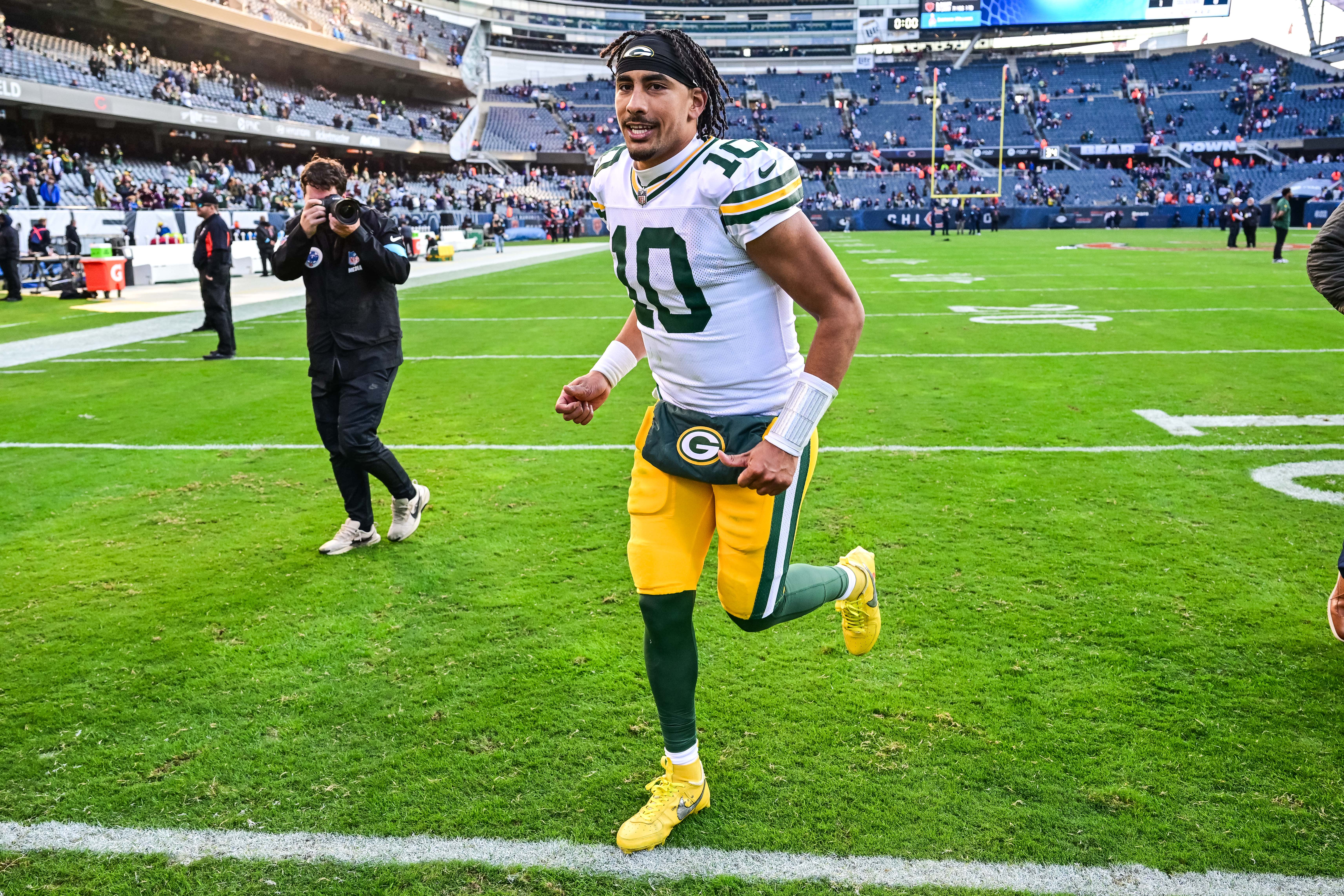 Green Bay Packers quarterback Jordan Love (10) runs off the field after the game against the Chicago Bears at Soldier Field.