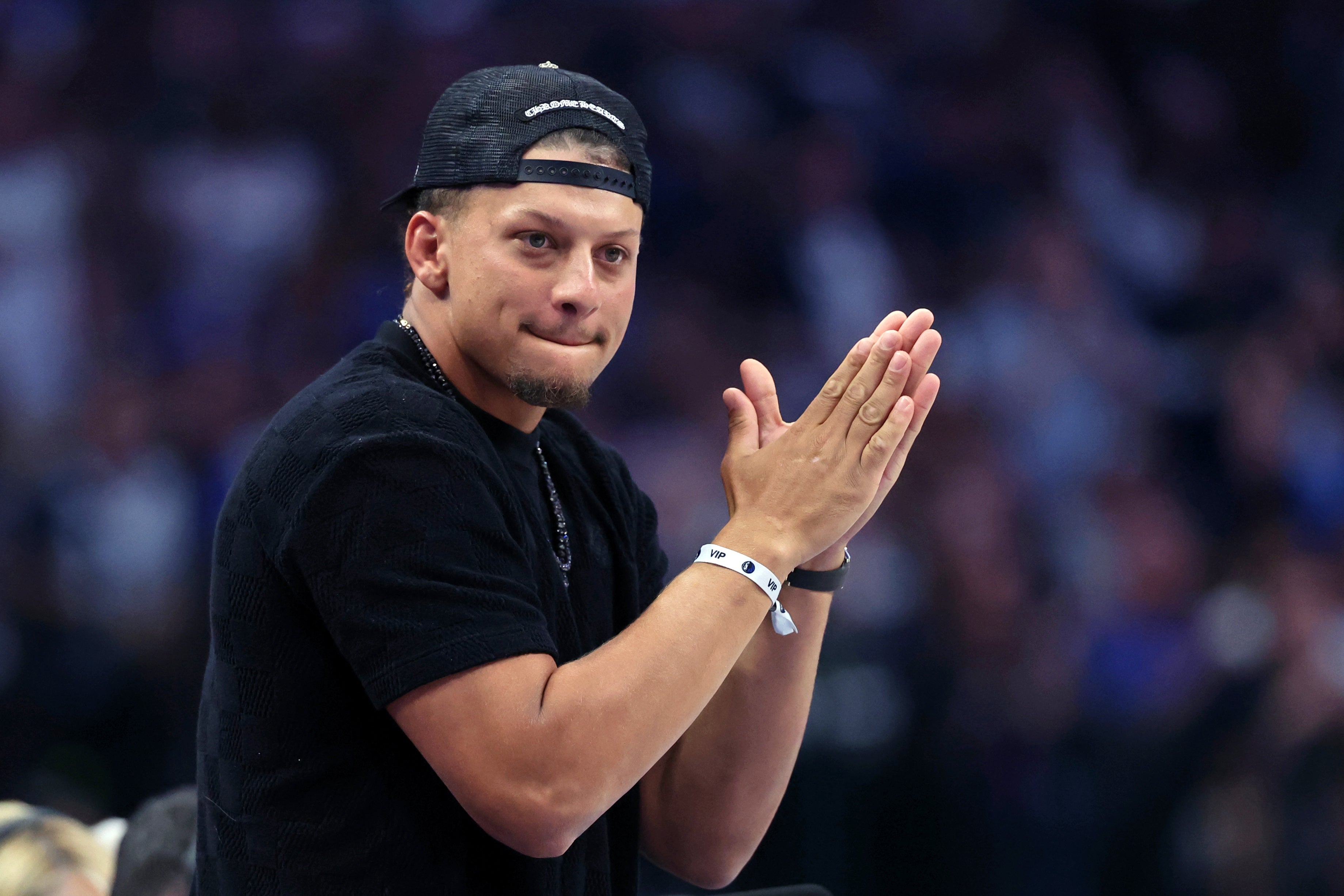 Jun 12, 2024; Dallas, Texas, USA; Kansas City Chiefs quarterback Patrick Mahomes reacts after a play during the second quarter during game three of the 2024 NBA Finals between the Boston Celtics and the Dallas Mavericks at American Airlines Center.