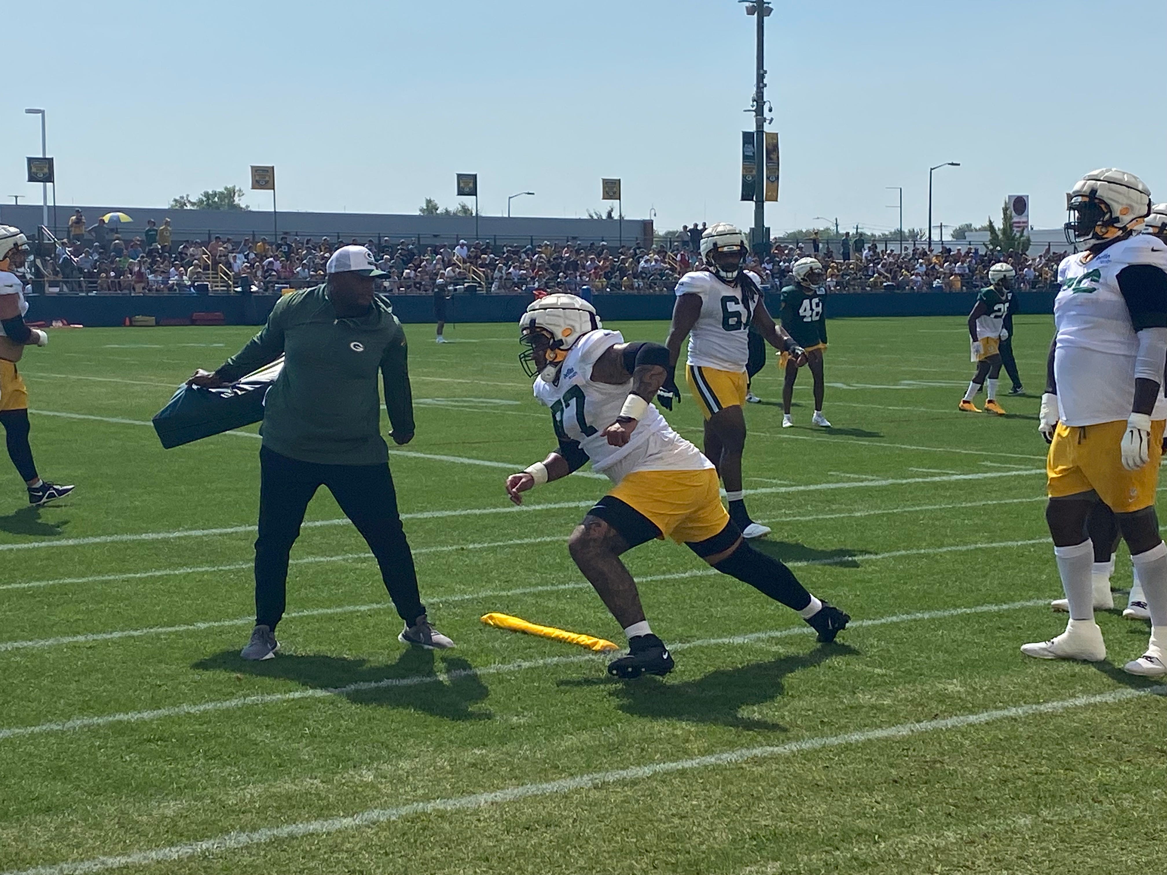 Green Bay Packers offensive lineman Jordan Morgan runs through drills at training camp practice on Tuesday, Aug. 13, 2024. He missed the last week with a shoulder injury.