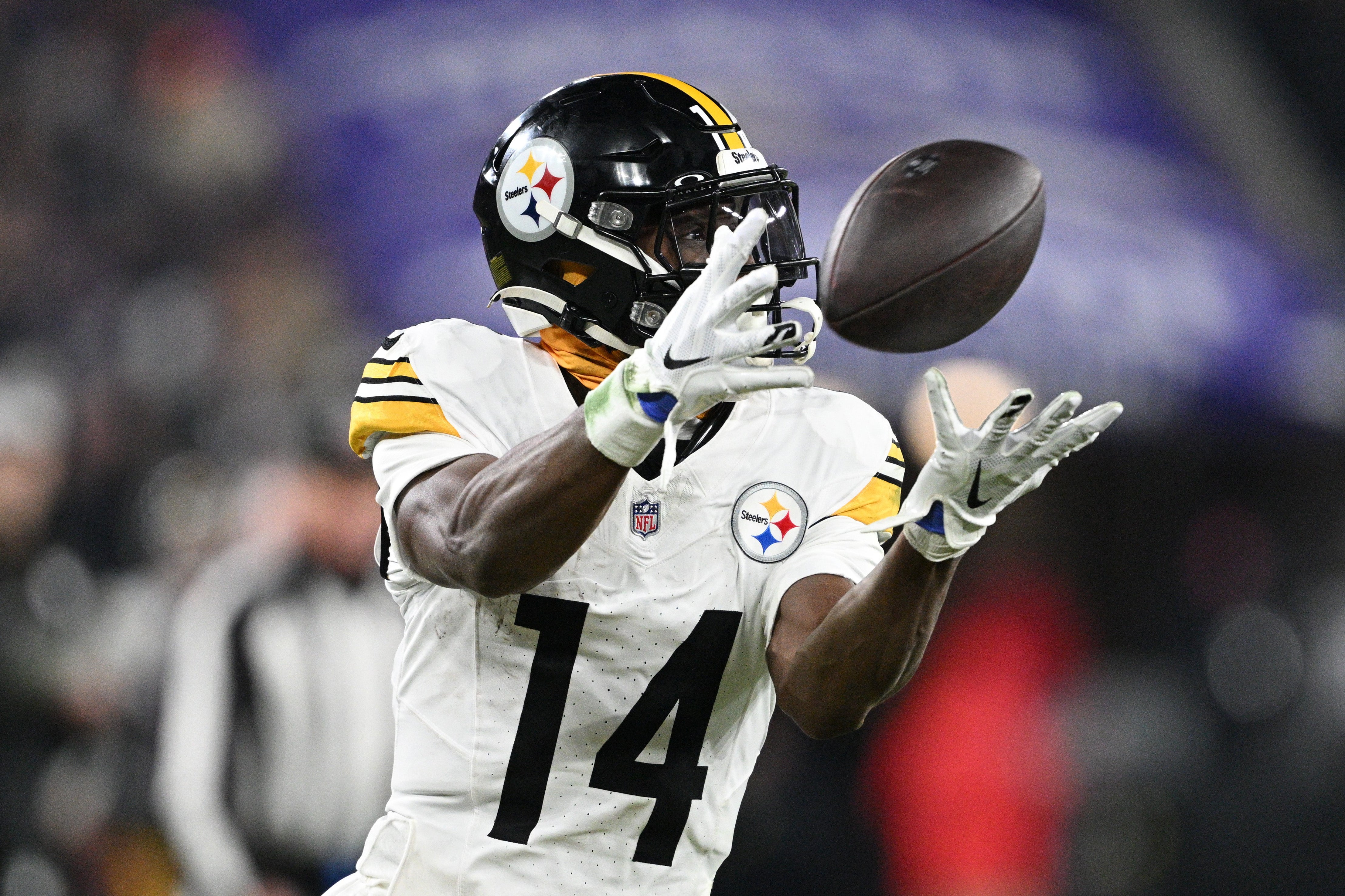 Jan 11, 2025; Baltimore, Maryland, USA; Pittsburgh Steelers wide receiver George Pickens (14) makes a catch against the Baltimore Ravens in the third quarter in an AFC wild card game at M&T Bank Stadium.