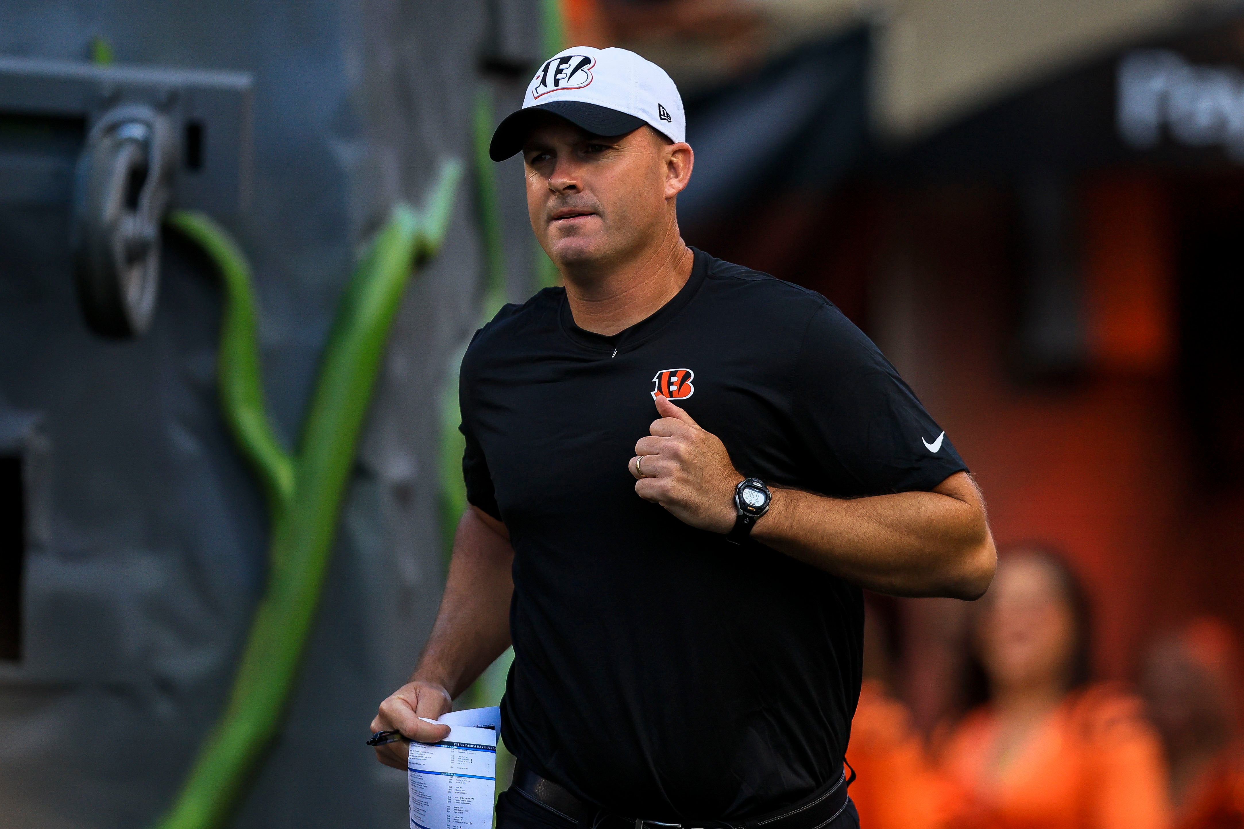 Aug 10, 2024; Cincinnati, Ohio, USA; Cincinnati Bengals head coach Zac Taylor runs onto the field before the game against the Tampa Bay Buccaneers at Paycor Stadium.