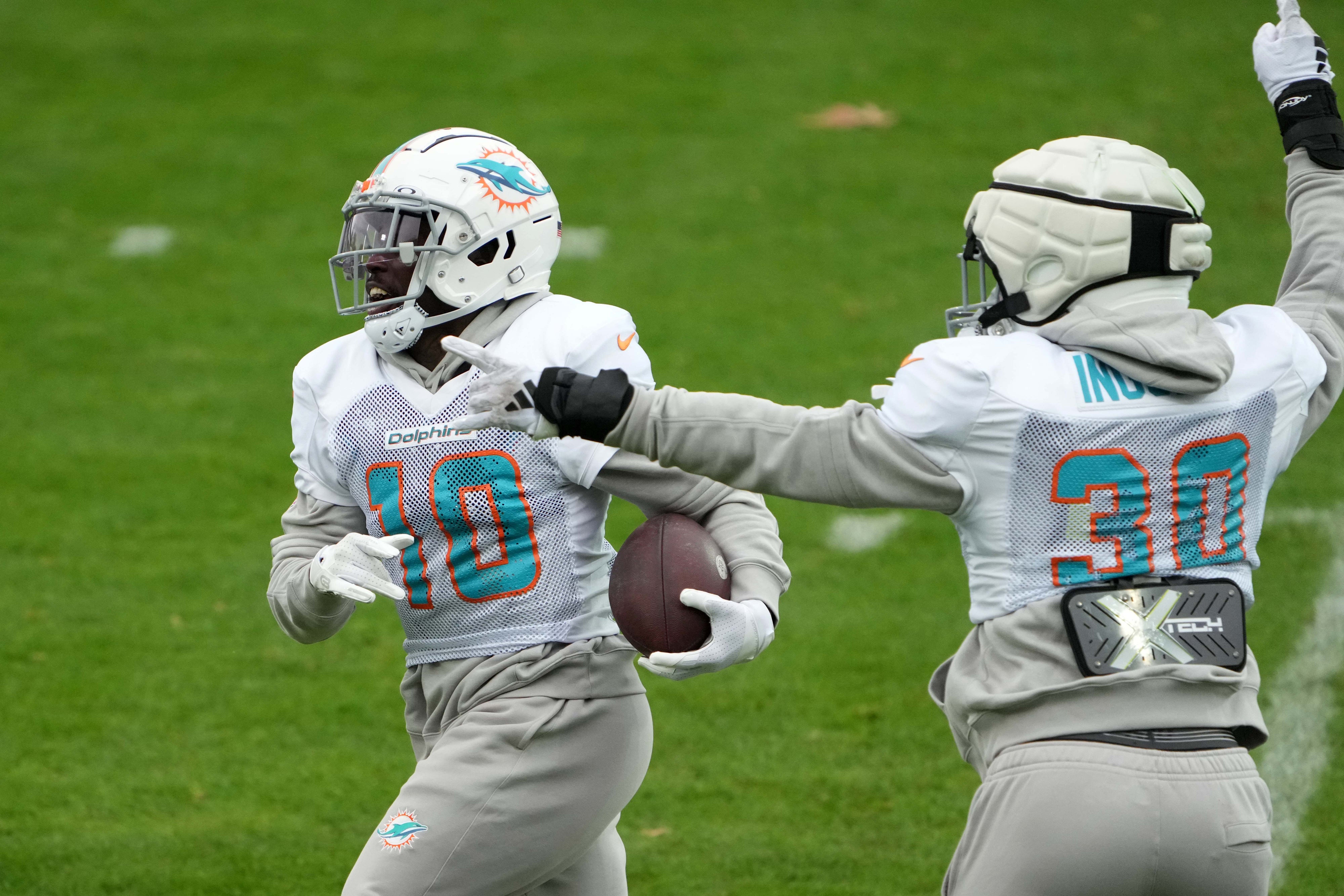 Nov 2, 2023; Frankfurt, Germany; Miami Dolphins wide receiver Tyreek Hill (10) and fullback Alec Ingold (30) during practice at the PSD Bank Arena.