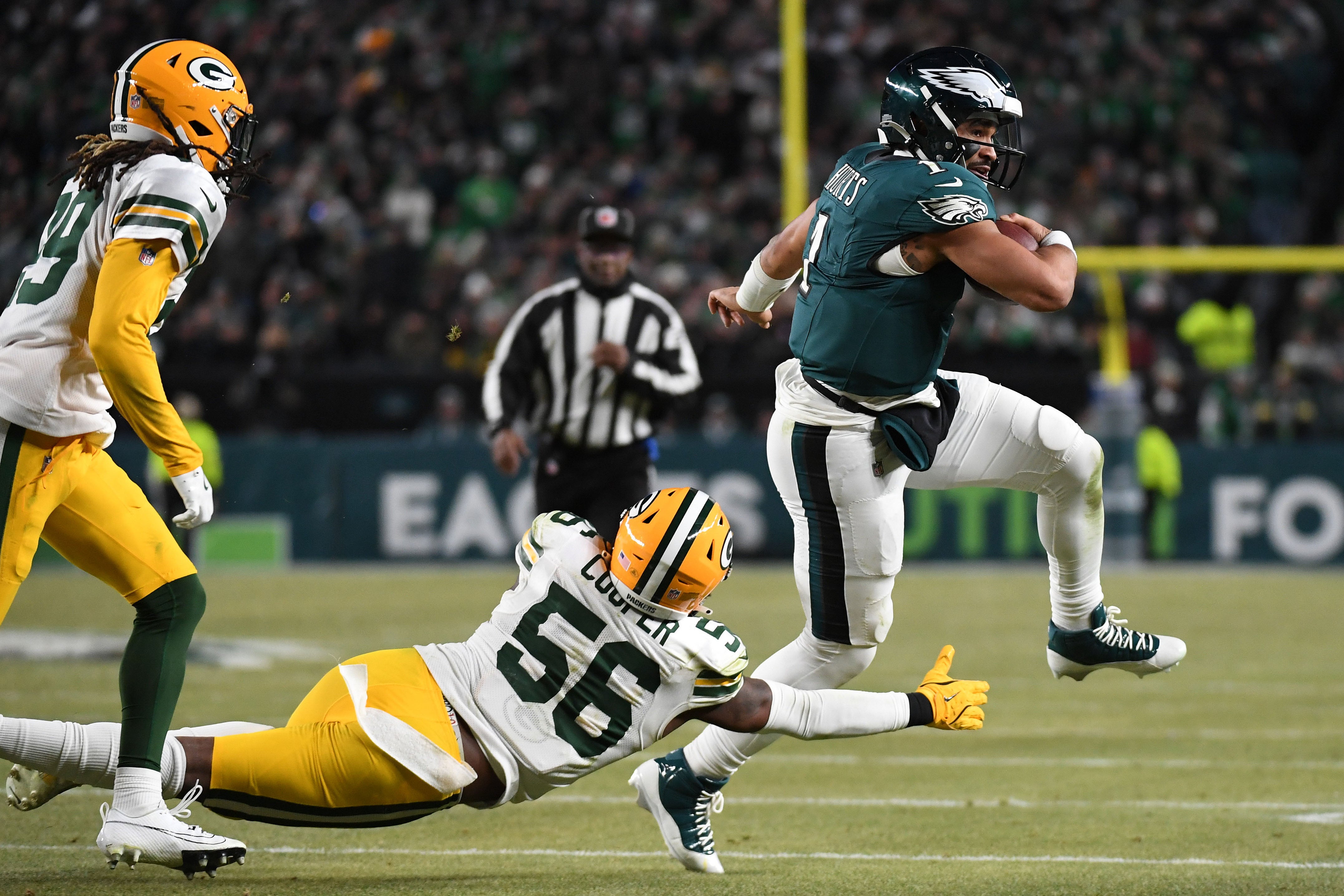 Philadelphia Eagles quarterback Jalen Hurts (1) rushes the ball against the Green Bay Packers during the second half in an NFC wild card game at Lincoln Financial Field.