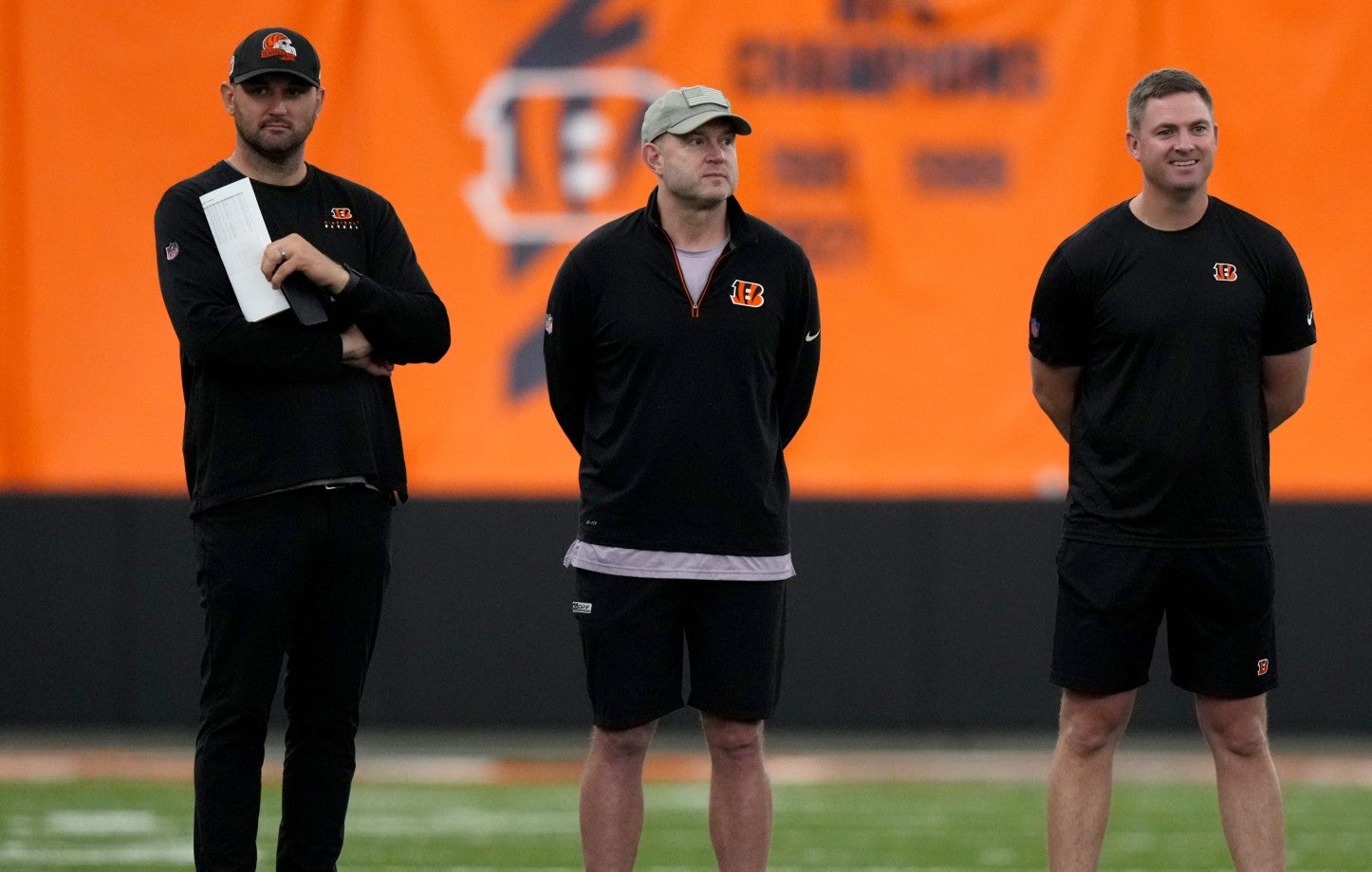 Director of College Scouting Mike Potts, Director of Player Personnel Duke Tobin, and head coach Zac Taylor talk inside the Bengals' indoor practice bubble in Cincinnati on May 12, 2023.
