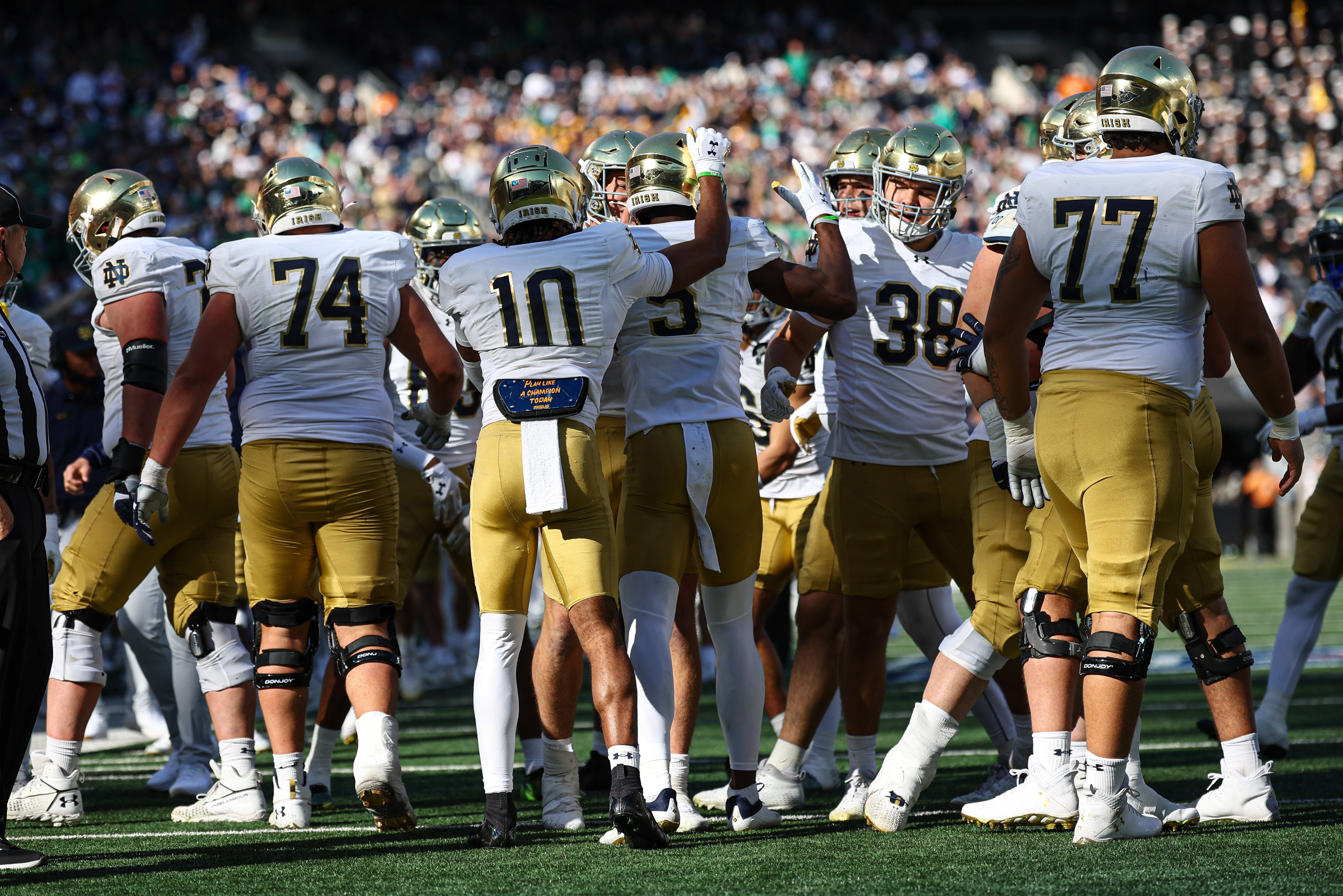 Oct 26, 2024; East Rutherford, New Jersey, USA; Notre Dame Fighting Irish defensive lineman Boubacar Traore (5) celebrates his intercept with teammates during the second half against the Navy Midshipmen at MetLife Stadium. Mandatory Credit: Vincent Carchietta-Imagn Images  