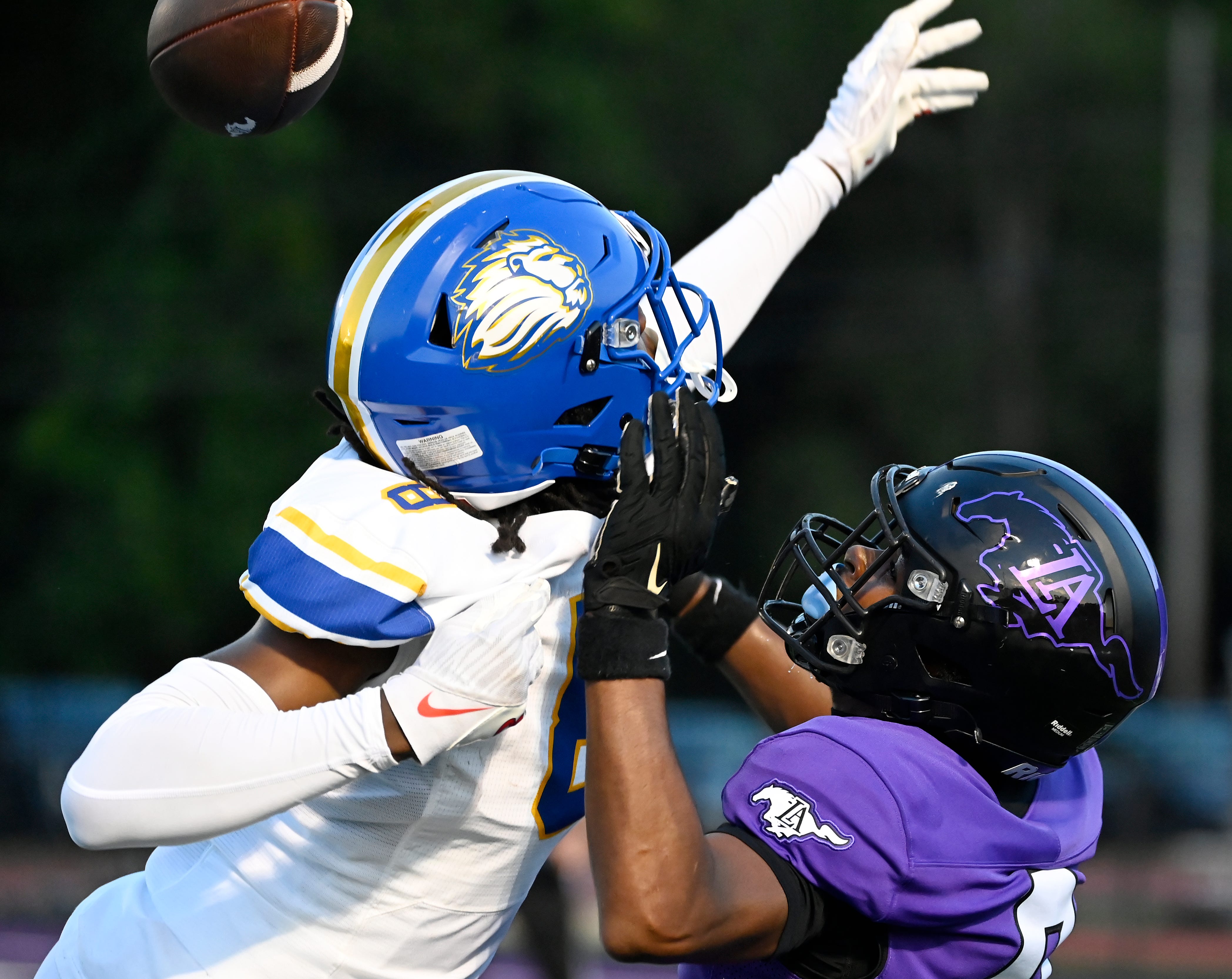 First Academy safety Danny Odem (8) breaks up a pass intended for Lipscomb Academy wide receiver Bo Strickland (0) during an high school football game Thursday, Aug. 22, 2024, in Nashville, Tenn.