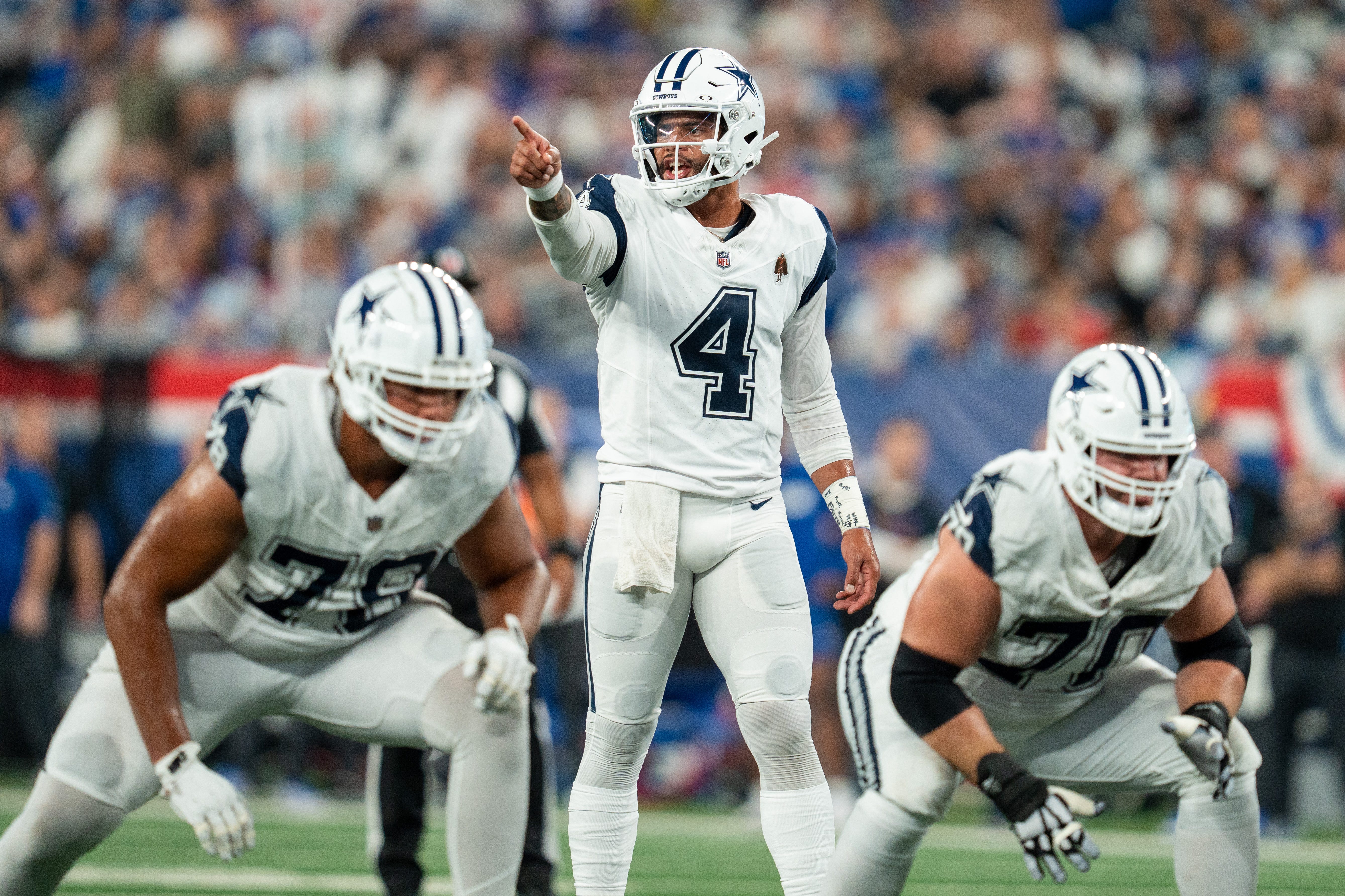 Dallas Cowboys quarterback Dak Prescott (4) calls out the defense prior to the snap of the ball at MetLife Stadium.
