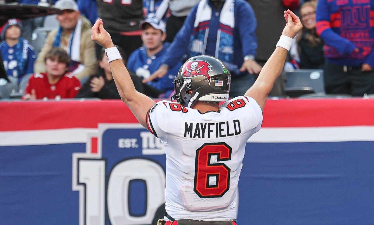 Nov 24, 2024; East Rutherford, New Jersey, USA; Tampa Bay Buccaneers quarterback Baker Mayfield (6) gestures after scoring a rushing touchdown during the first half against the New York Giants at MetLife Stadium.