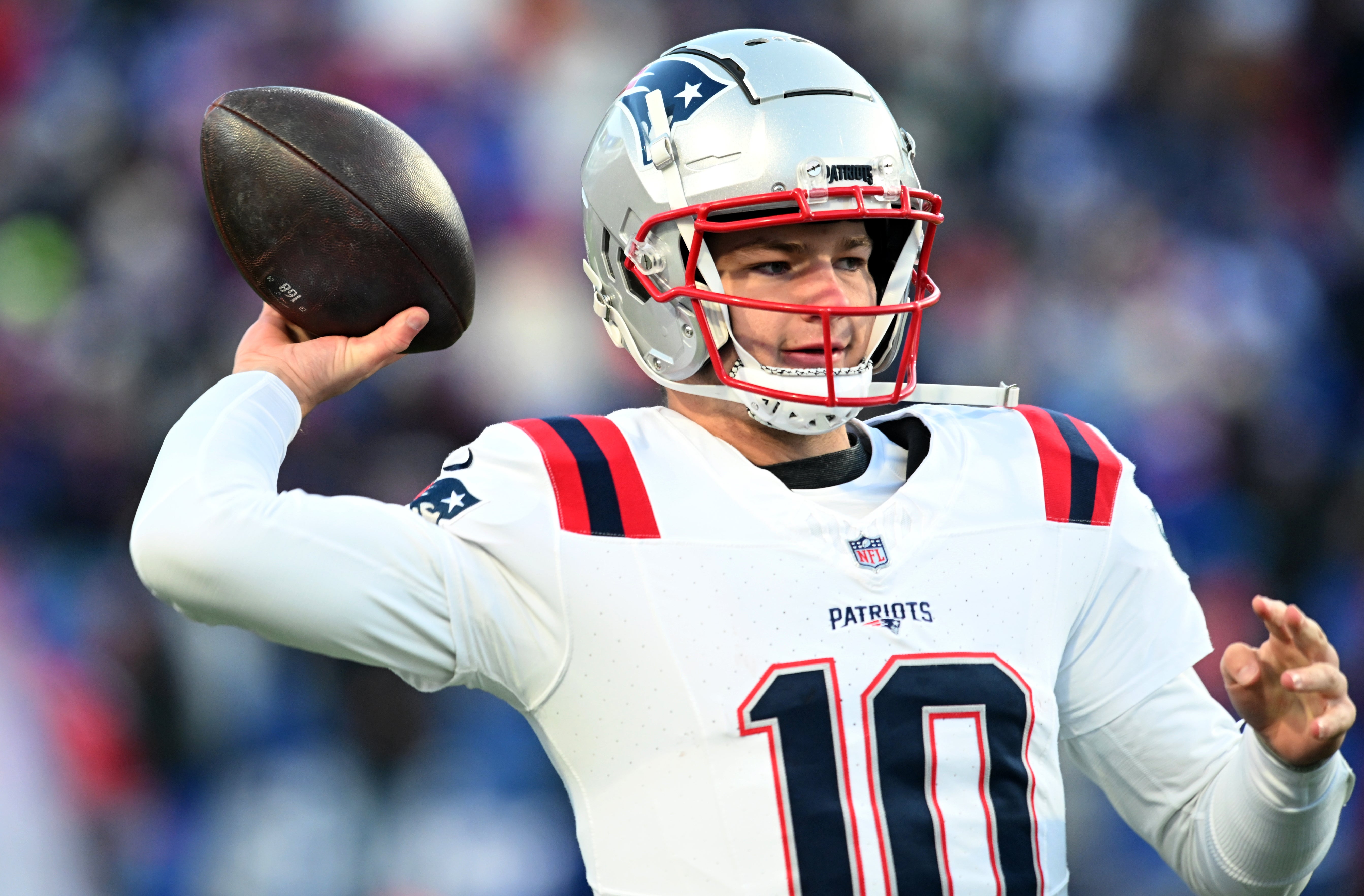 Dec 22, 2024; Orchard Park, New York, USA; New England Patriots quarterback Drake Maye (10) warms up before a game against the Buffalo Bills at Highmark Stadium.
