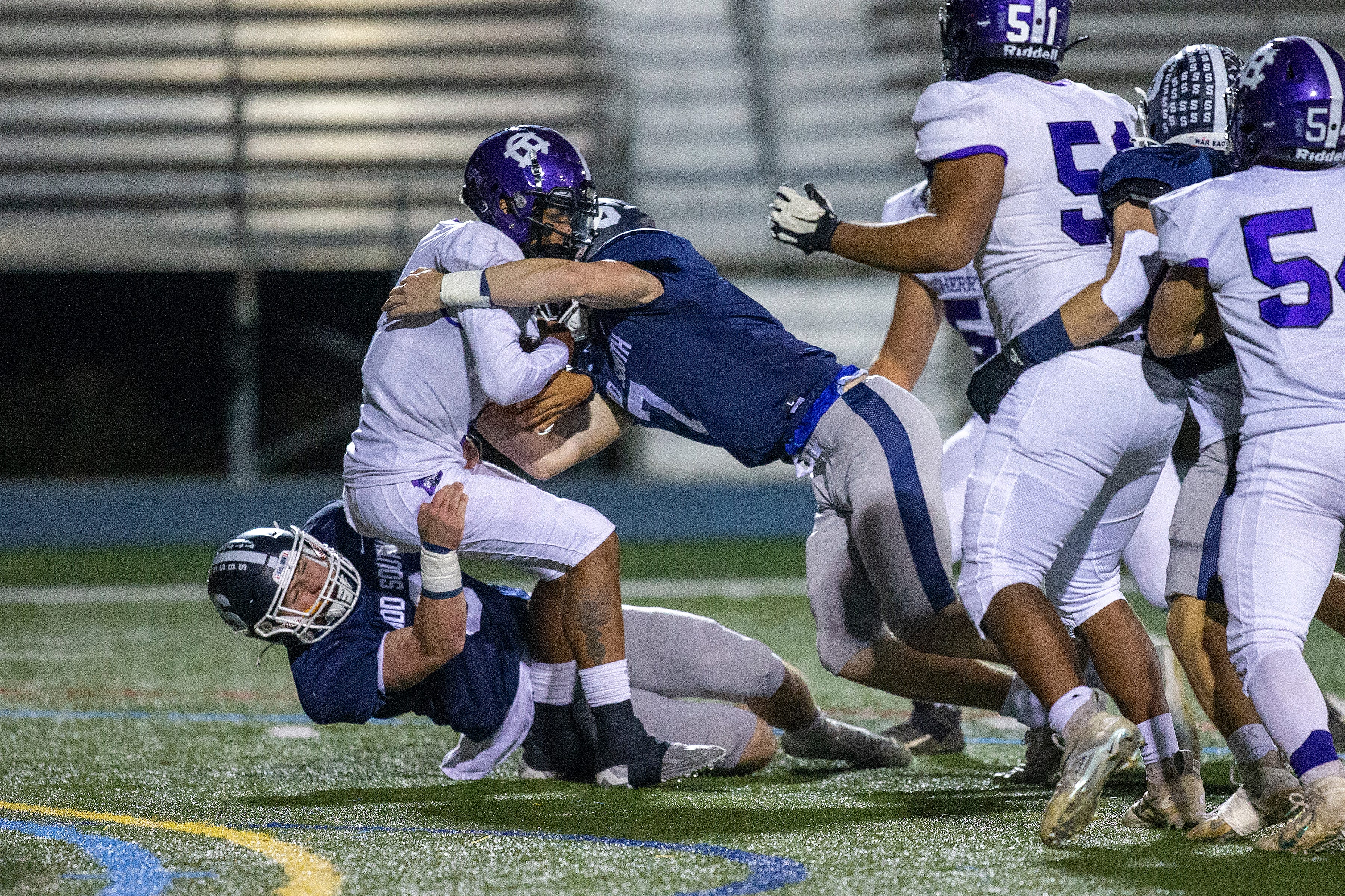 Cherry Hill West's Jordon DeJesus Gonzalez is sacked by Middletown South's Colin Gallagher and Luke Wafle during the first half of the Cherry Hill West vs. Middletown South NJSIAA Central Group 4 playoff football game at Middletown High School South in Middletown, NJ Friday, October 28, 2022.