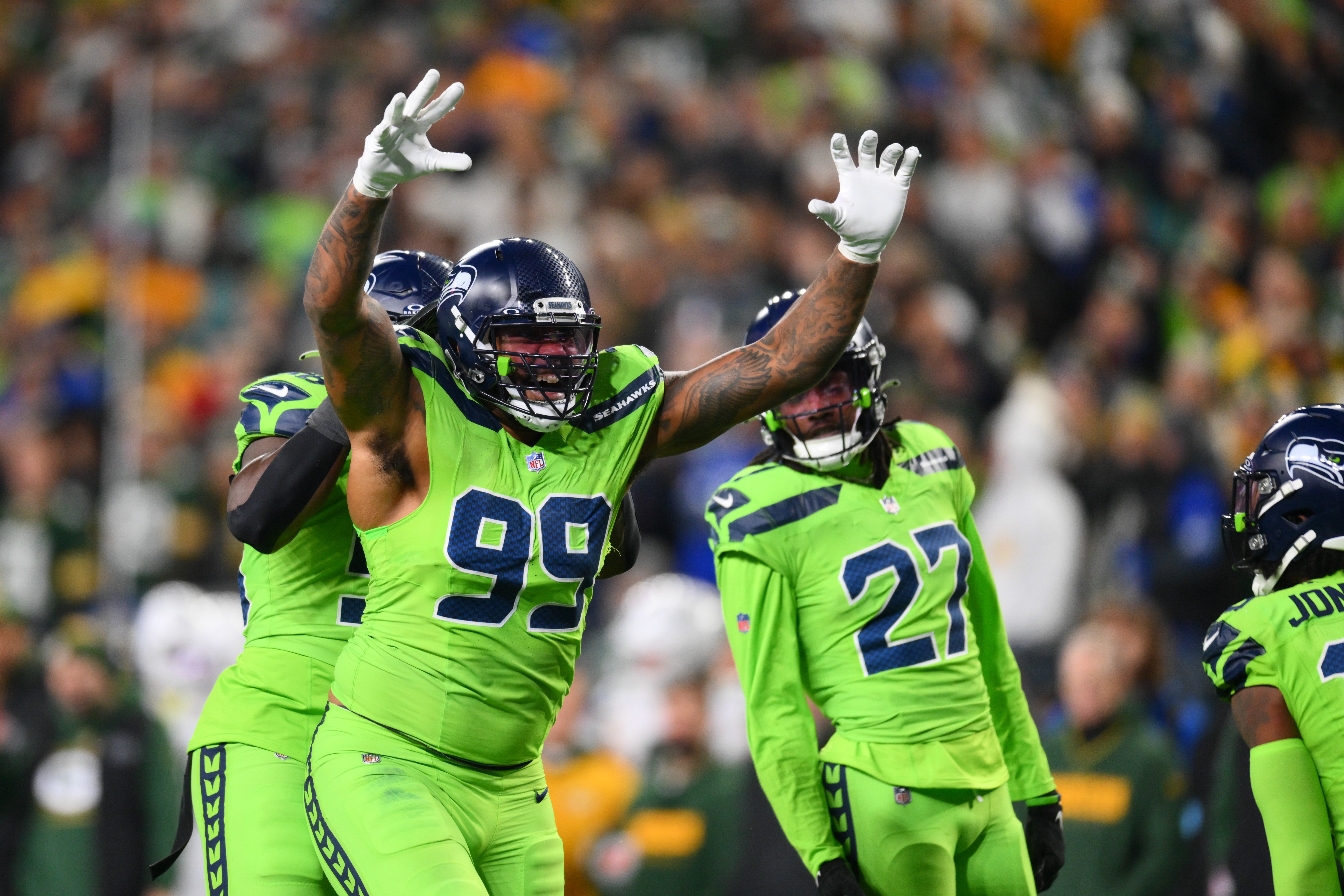 Seattle Seahawks defensive end Leonard Williams (99) celebrates after a defensive play against the Green Bay Packers