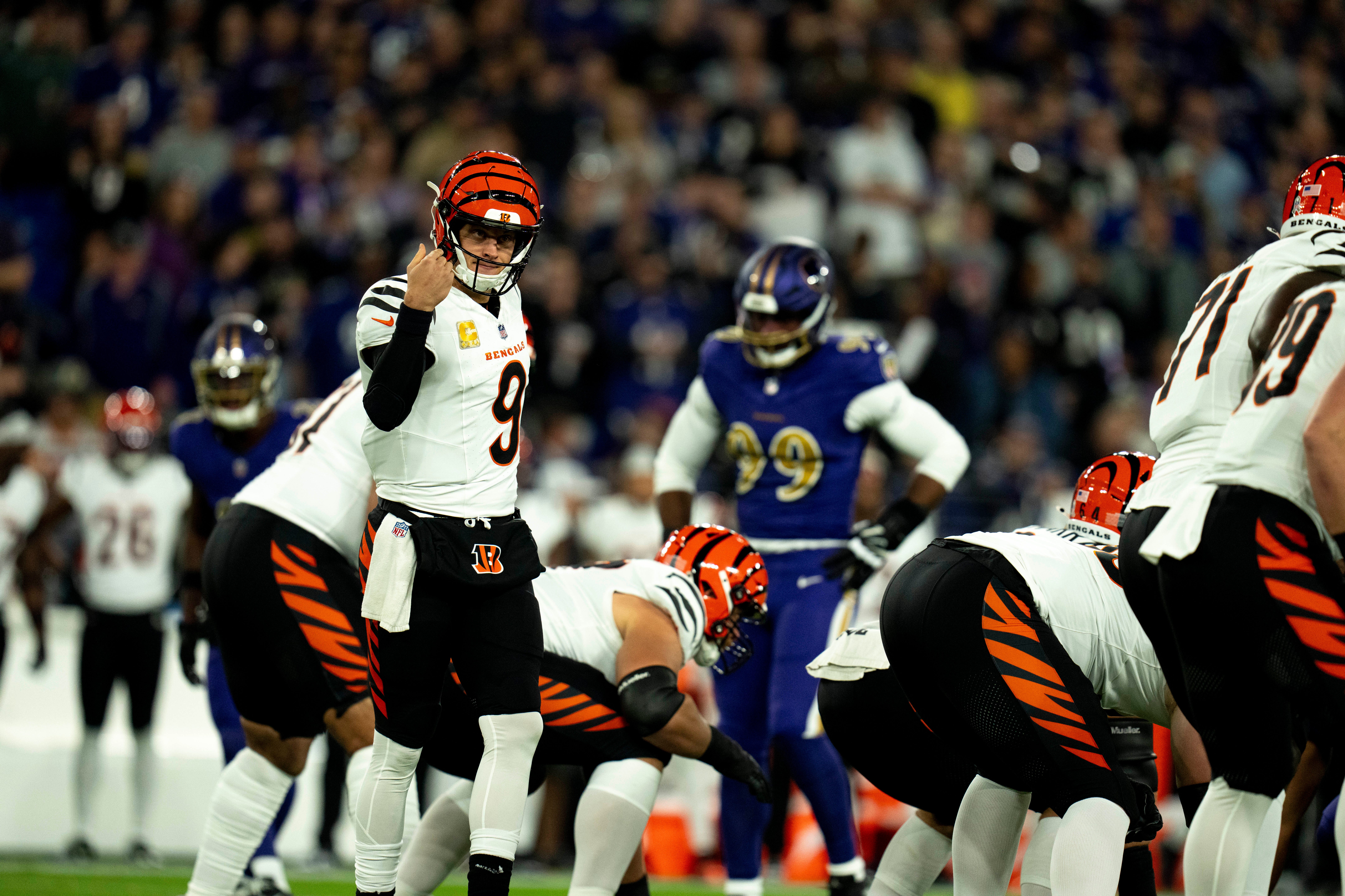 Cincinnati Bengals quarterback Joe Burrow (9) communicates with his team in the first quarter of the NFL game against the Baltimore Ravens at M&T Banks Stadium in Baltimore on Thursday, Nov. 7, 2024.