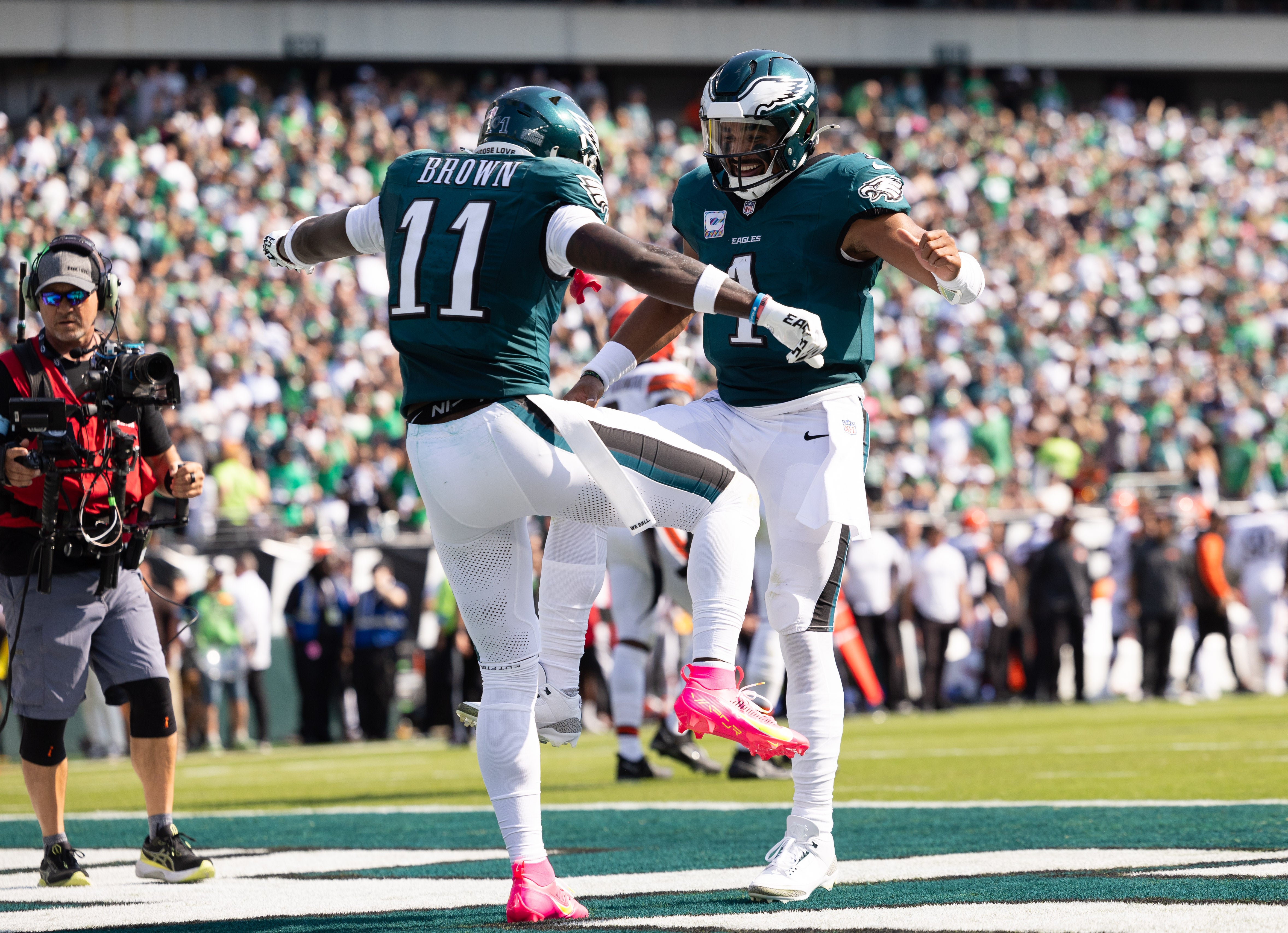 Philadelphia Eagles quarterback Jalen Hurts (1) and wide receiver A.J. Brown (11) celebrate their touchdown pass during the second quarter against the Cleveland Browns at Lincoln Financial Field.