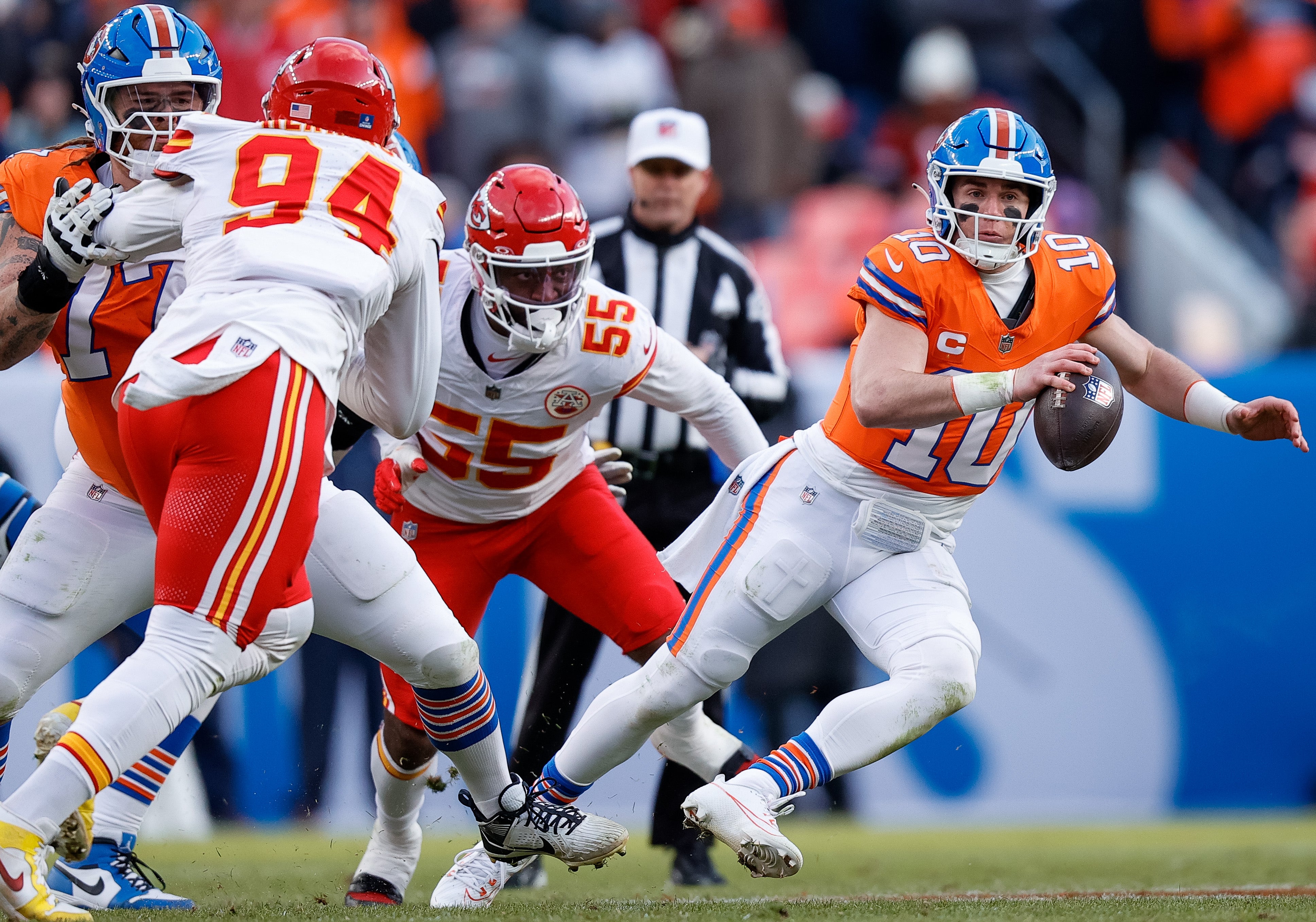 Denver Broncos quarterback Bo Nix (10) scrambles under pressure from Kansas City Chiefs linebacker Joshua Uche (55) as guard Quinn Meinerz (77) defends against defensive end Malik Herring (94)