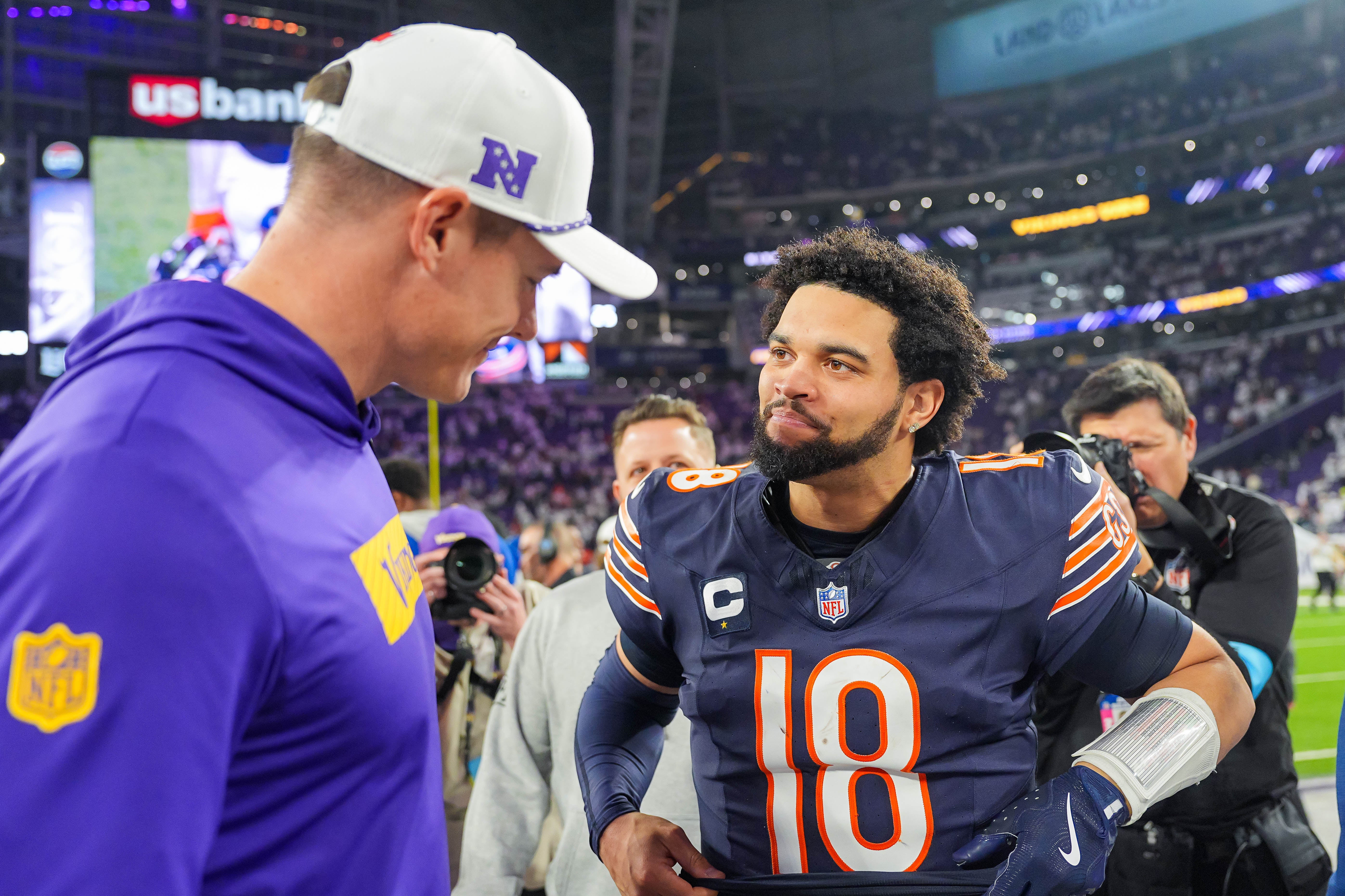Dec 16, 2024; Minneapolis, Minnesota, USA; Chicago Bears quarterback Caleb Williams (18) talks to Minnesota Vikings head coach Kevin O'Connell after the game quarter at U.S. Bank Stadium.